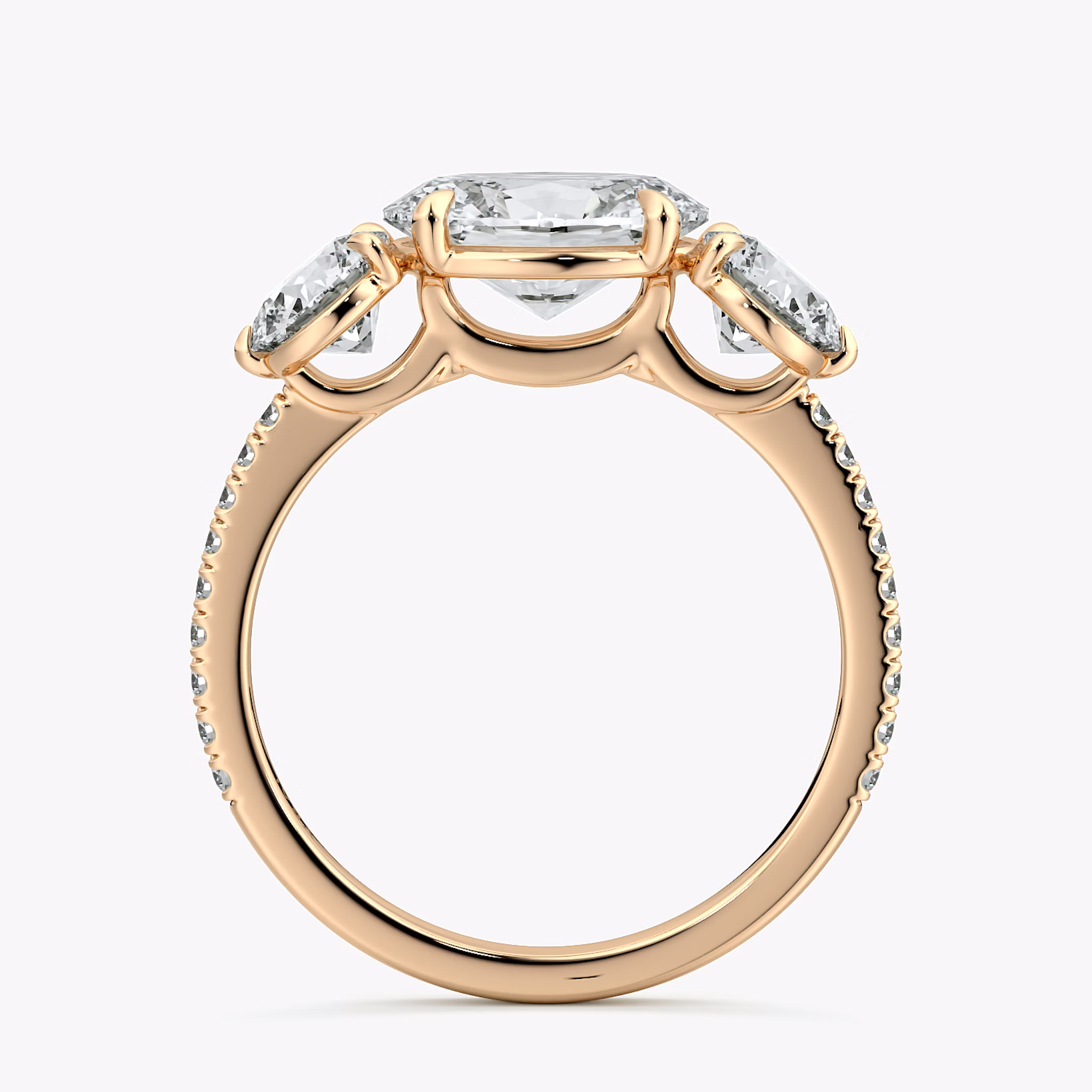 The Three Stone | Oval | 14k | Rose Gold | bandAccent: Pavé | diamondOrientation: horizontal | sideStoneCarat: 0.50ct | sideStoneShape: Round Brilliant | caratWeight: other