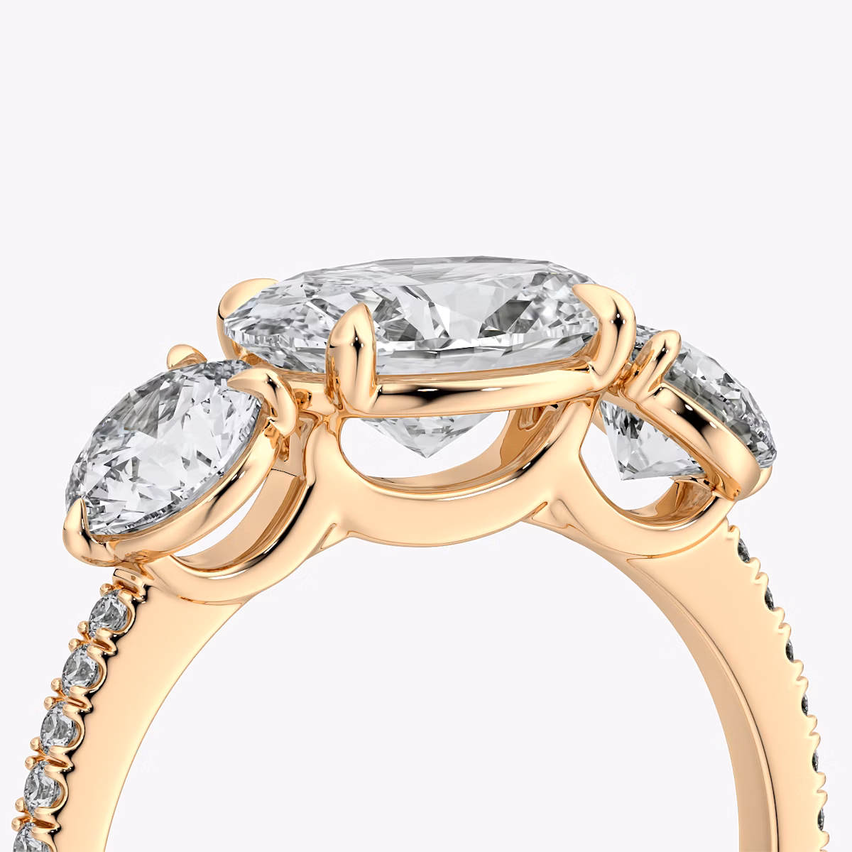 The Three Stone | Oval | 14k | Rose Gold | bandAccent: Pavé | diamondOrientation: horizontal | sideStoneCarat: 0.50ct | sideStoneShape: Round Brilliant | caratWeight: other