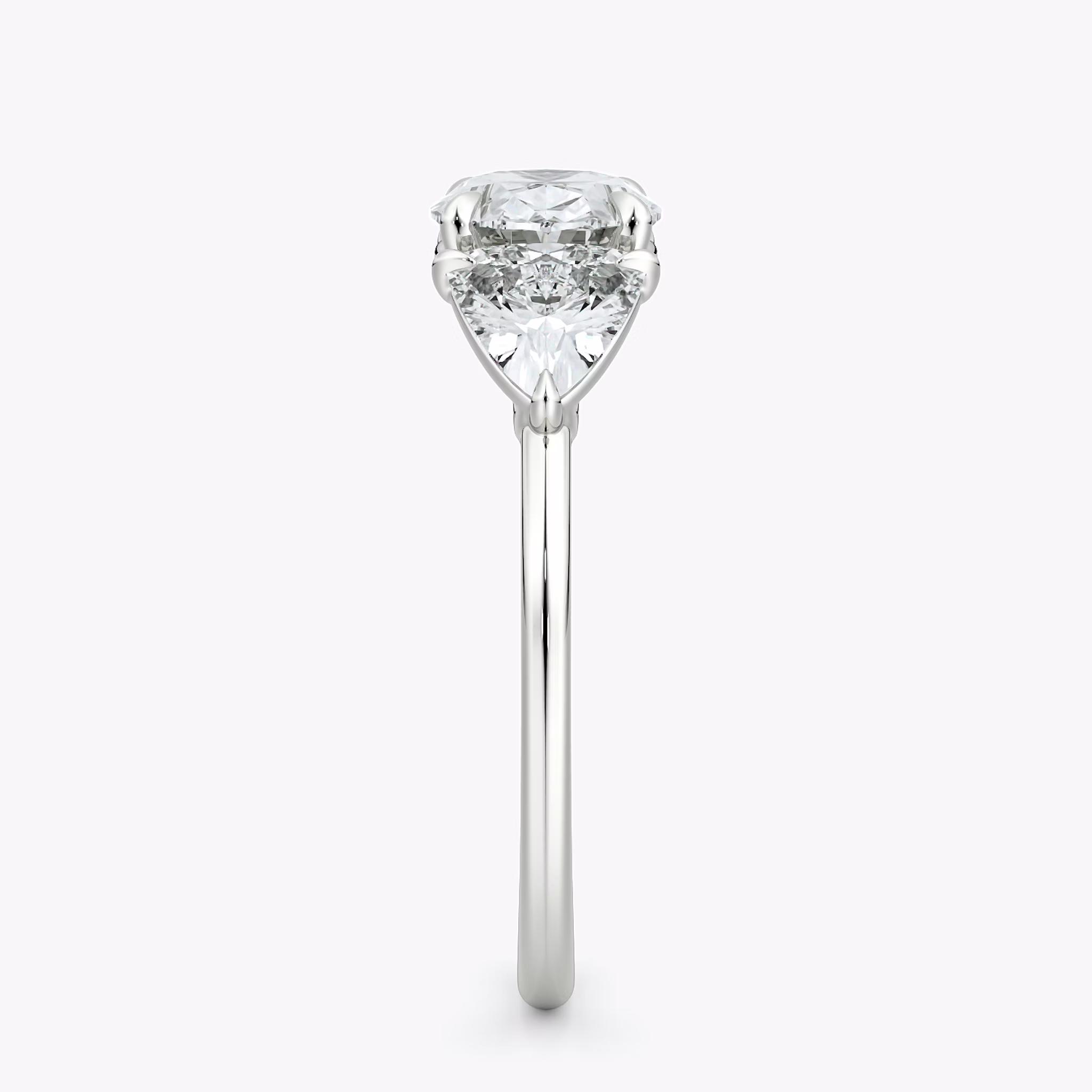 The Three Stone | Oval | 18k | White Gold | bandAccent: Plain | diamondOrientation: horizontal | sideStoneCarat: 0.50ct | sideStoneShape: Trillion | caratWeight: other