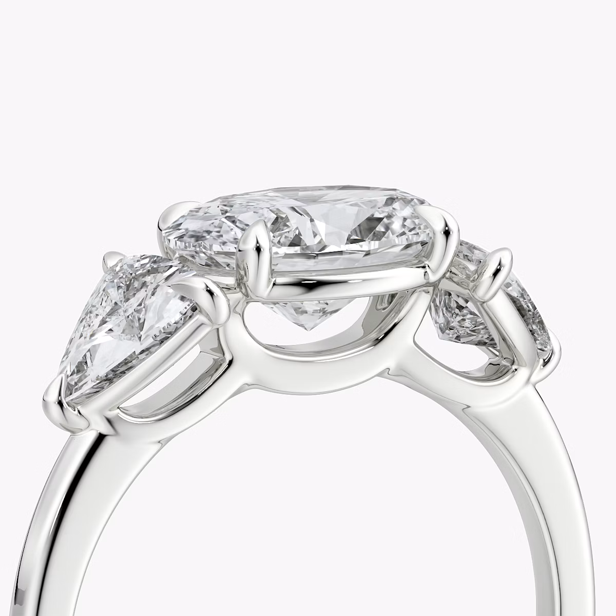 The Three Stone | Oval | 18k | White Gold | bandAccent: Plain | diamondOrientation: horizontal | sideStoneCarat: 0.50ct | sideStoneShape: Trillion | caratWeight: other