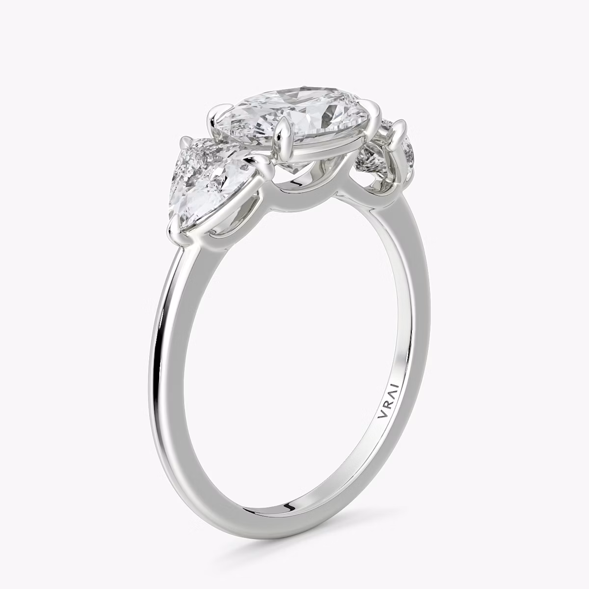 The Three Stone | Oval | 18k | White Gold | bandAccent: Plain | diamondOrientation: horizontal | sideStoneCarat: 0.50ct | sideStoneShape: Trillion | caratWeight: other