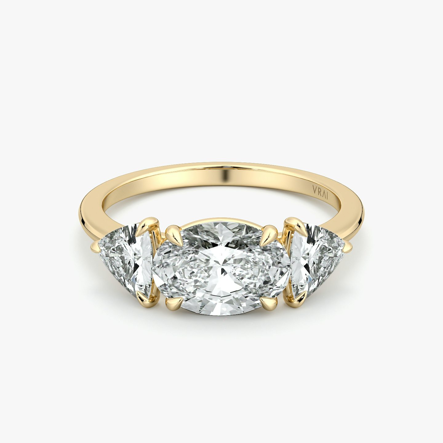 The Three Stone | Oval | 18k | Yellow Gold | bandAccent: Plain | diamondOrientation: horizontal | sideStoneCarat: 0.50ct | sideStoneShape: Trillion | caratWeight: other