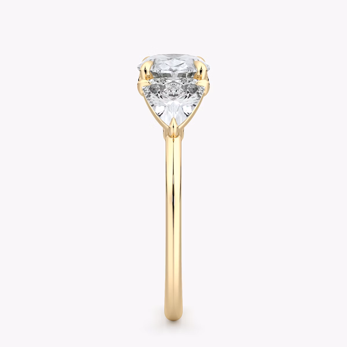 The Three Stone | Oval | 18k | Yellow Gold | bandAccent: Plain | diamondOrientation: horizontal | sideStoneCarat: 0.50ct | sideStoneShape: Trillion | caratWeight: other