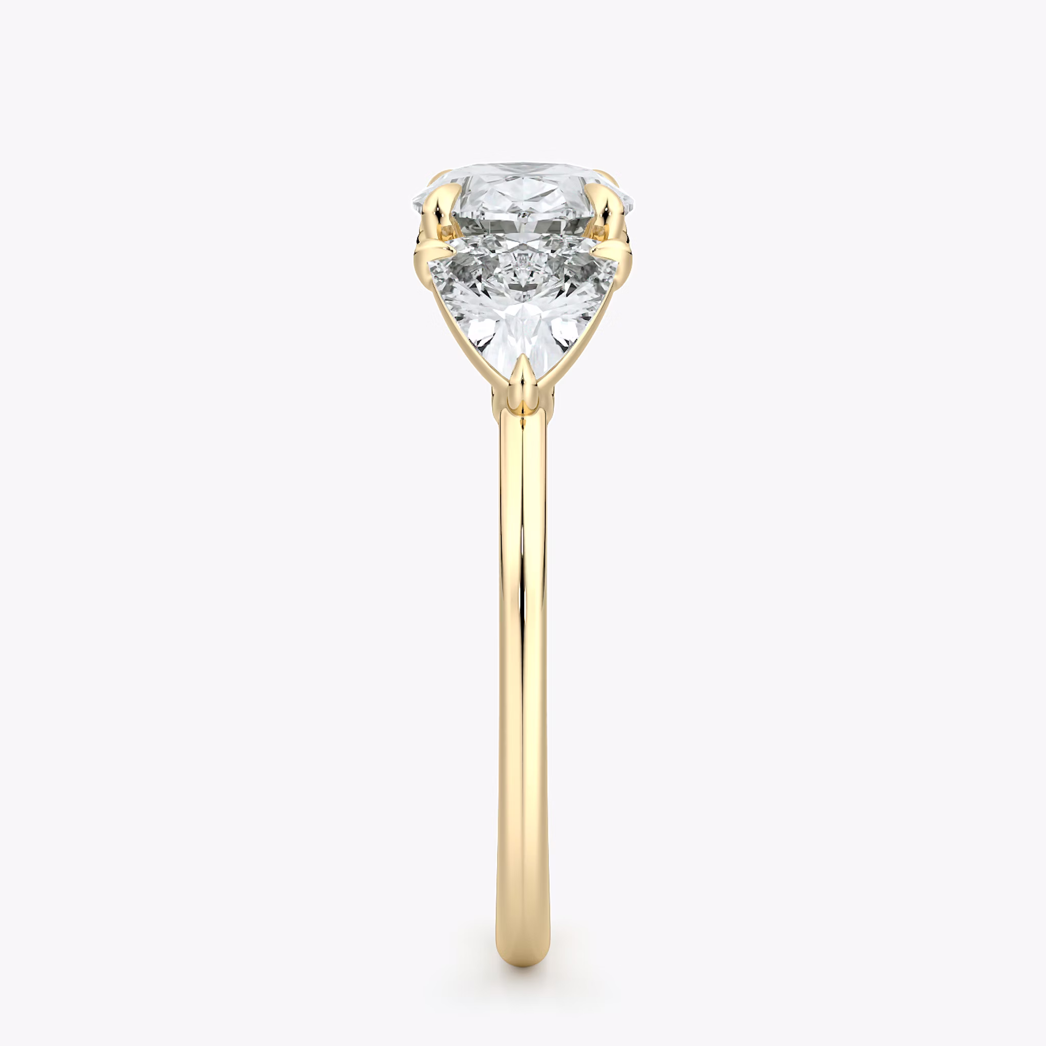 The Three Stone | Oval | 18k | Yellow Gold | bandAccent: Plain | diamondOrientation: horizontal | sideStoneCarat: 0.50ct | sideStoneShape: Trillion | caratWeight: other