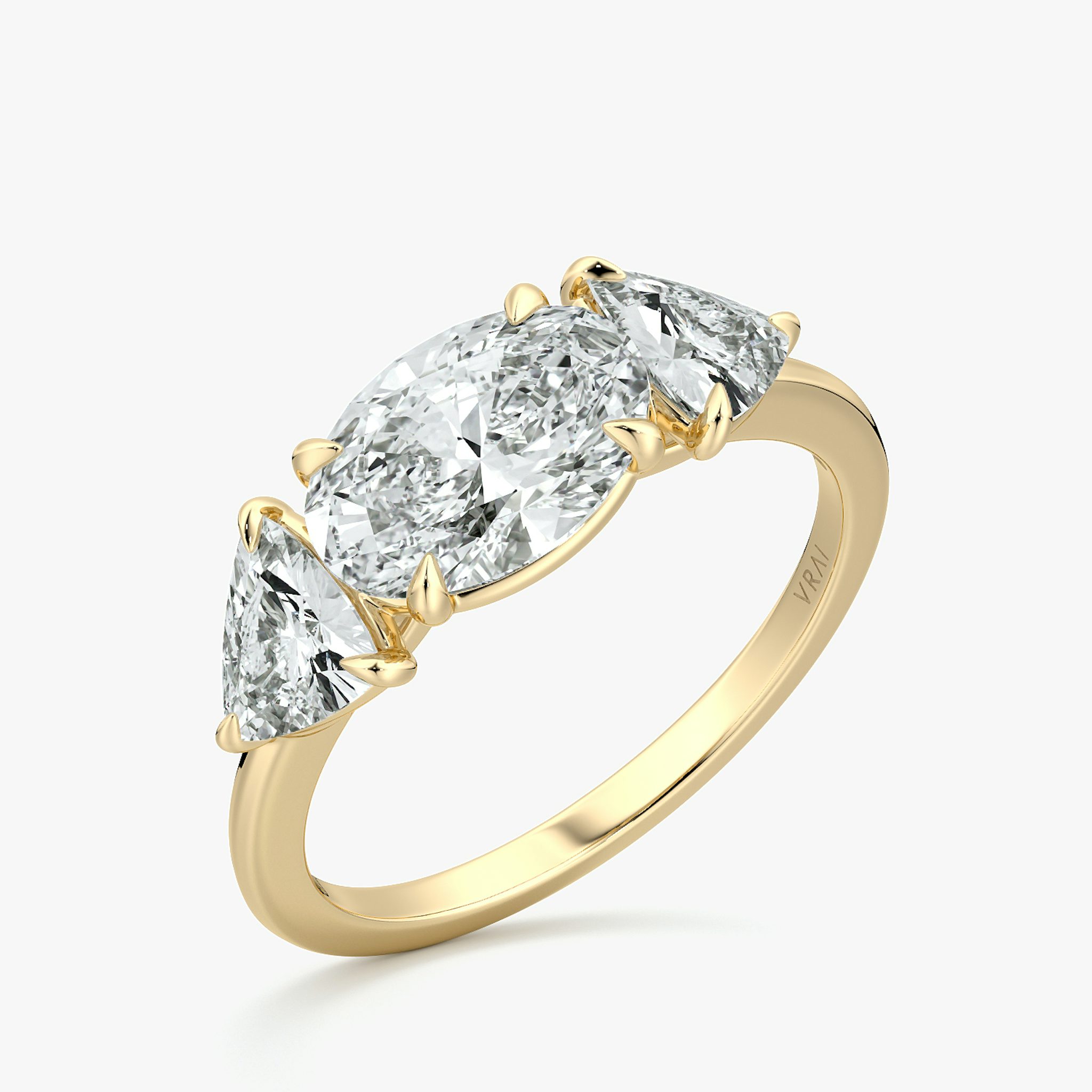 The Three Stone | Oval | 18k | Yellow Gold | bandAccent: Plain | diamondOrientation: horizontal | sideStoneCarat: 0.50ct | sideStoneShape: Trillion | caratWeight: other