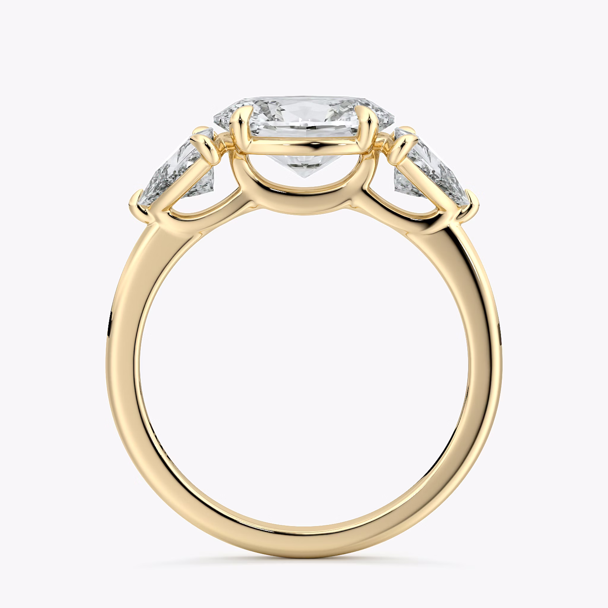 The Three Stone | Oval | 18k | Yellow Gold | bandAccent: Plain | diamondOrientation: horizontal | sideStoneCarat: 0.50ct | sideStoneShape: Trillion | caratWeight: other