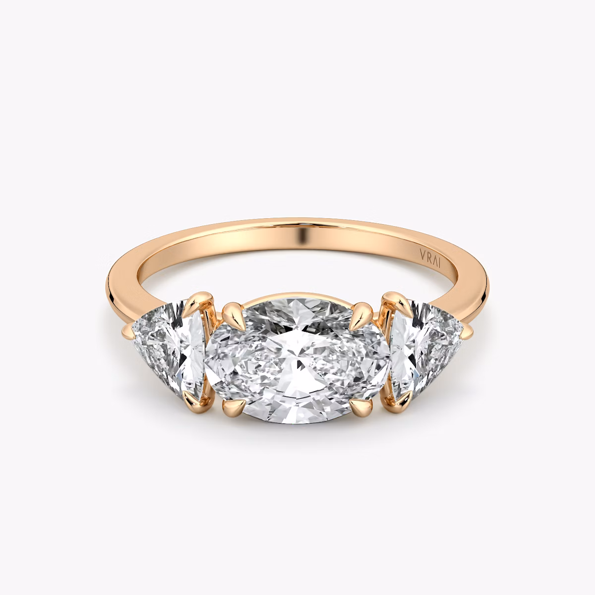 The Three Stone | Oval | 14k | Rose Gold | bandAccent: Plain | diamondOrientation: horizontal | sideStoneCarat: 0.50ct | sideStoneShape: Trillion | caratWeight: other
