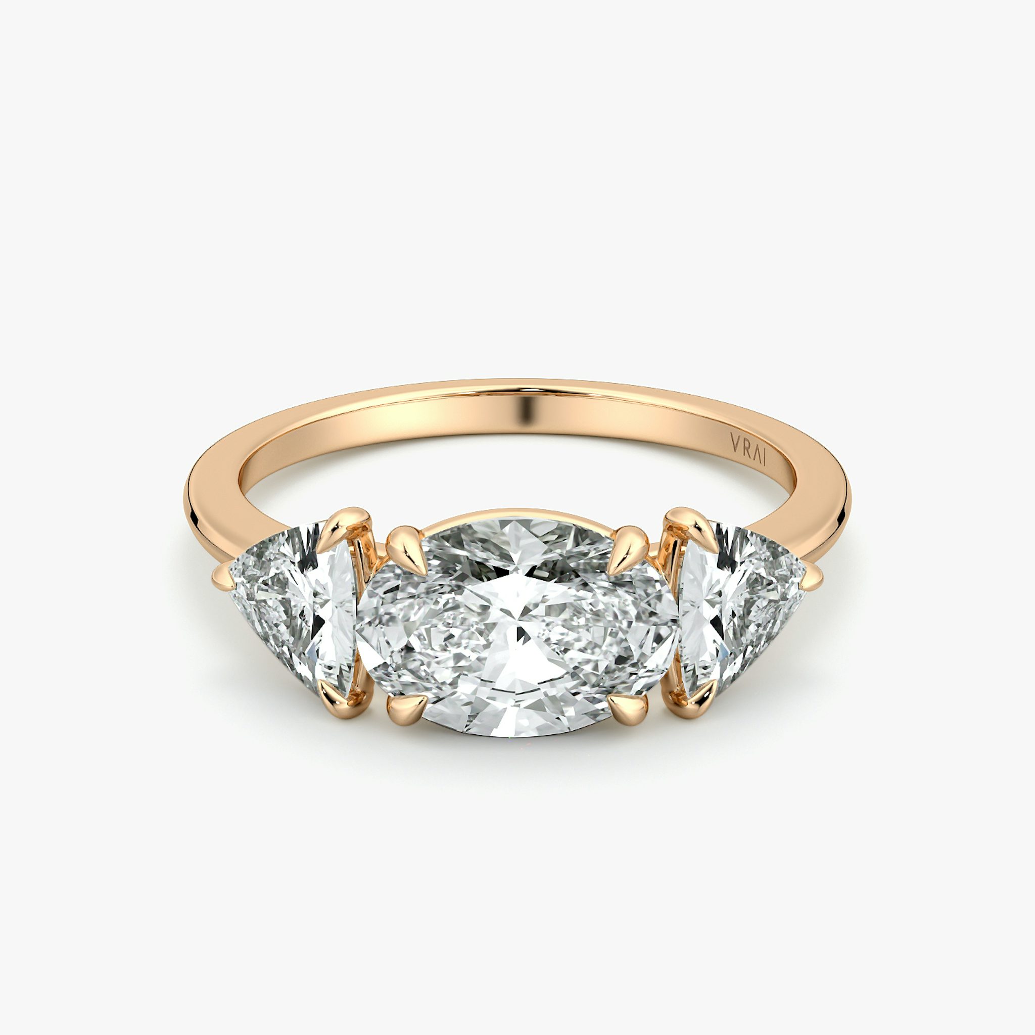 The Three Stone | Oval | 14k | Rose Gold | bandAccent: Plain | diamondOrientation: horizontal | sideStoneCarat: 0.50ct | sideStoneShape: Trillion | caratWeight: other