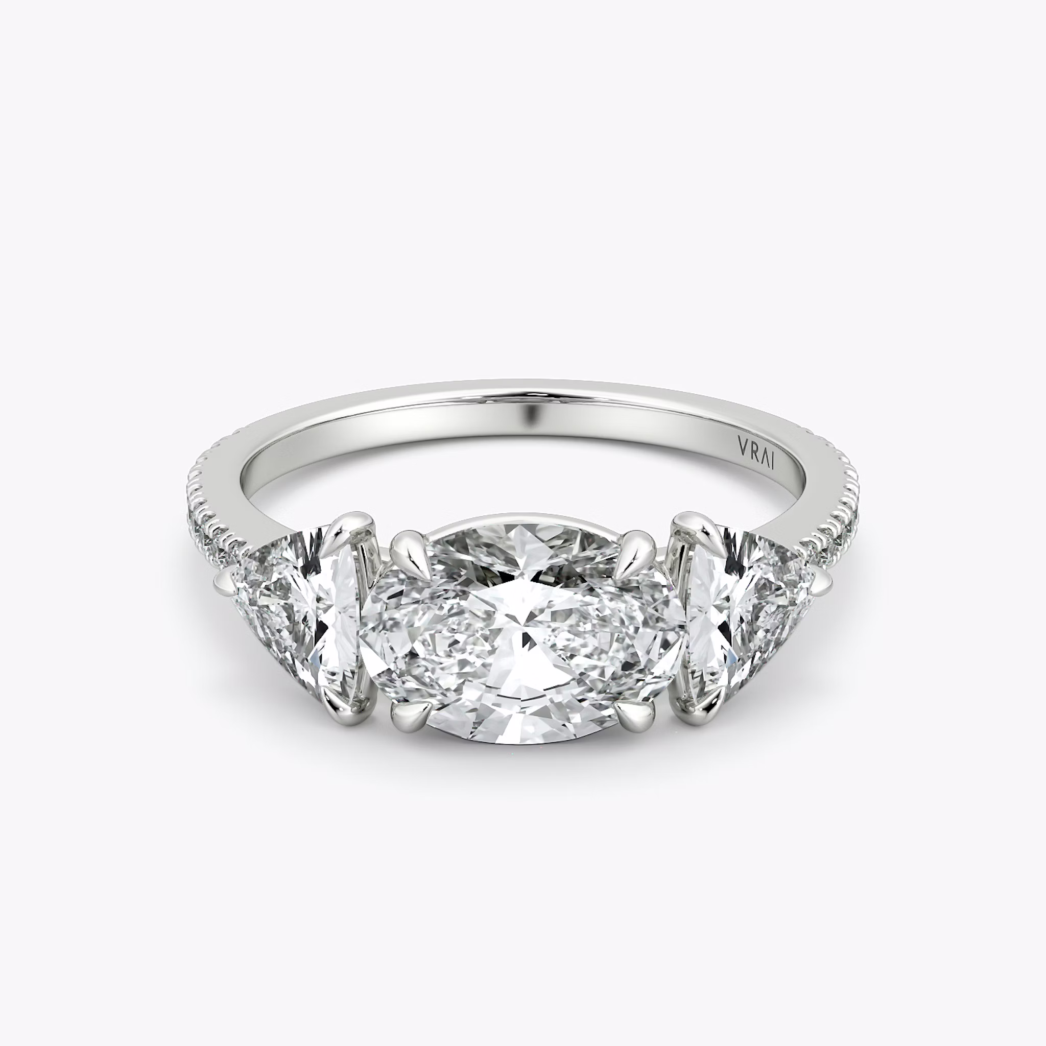 The Three Stone | Oval | 18k | White Gold | bandAccent: Pavé | diamondOrientation: horizontal | sideStoneCarat: 0.50ct | sideStoneShape: Trillion | caratWeight: other