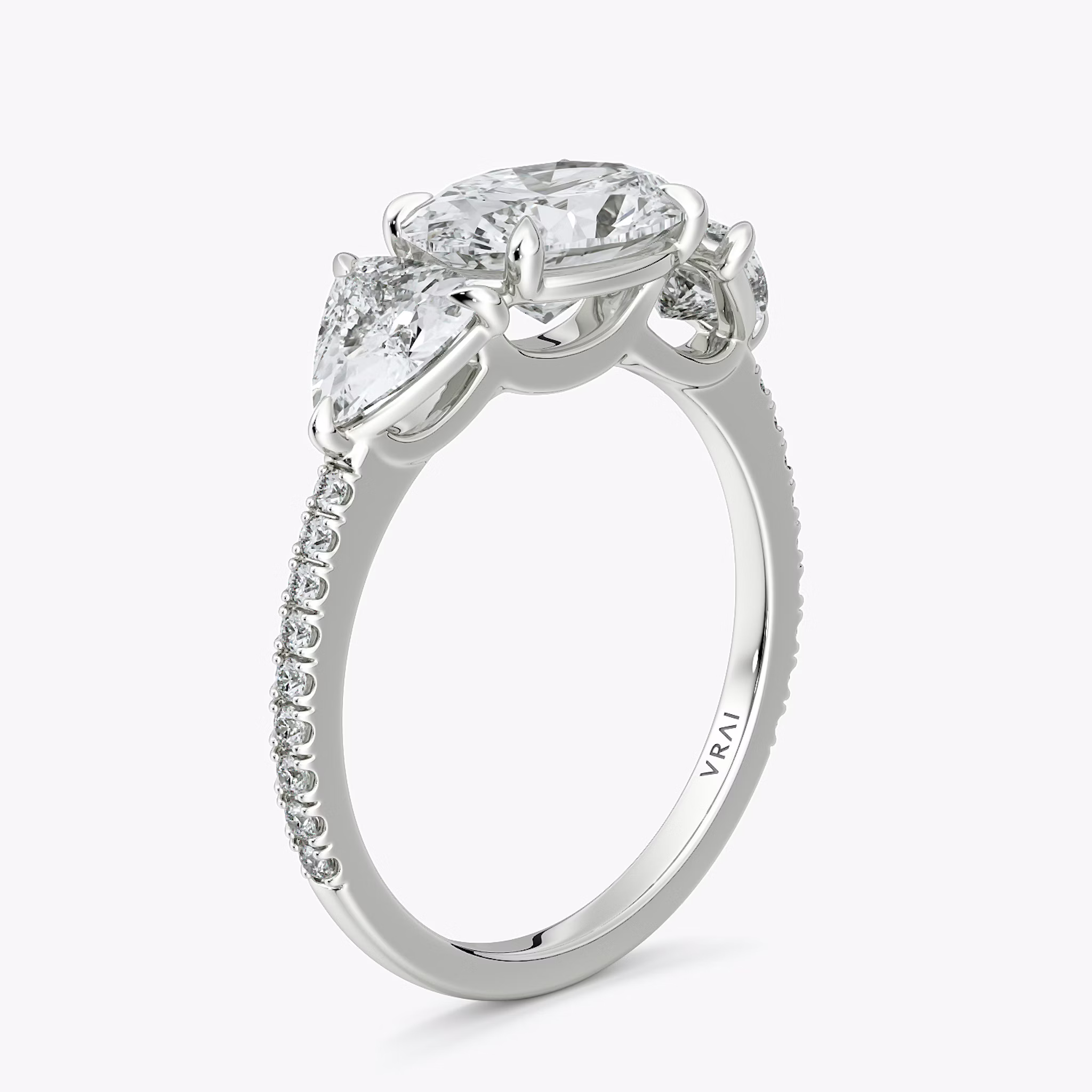 The Three Stone | Oval | 18k | White Gold | bandAccent: Pavé | diamondOrientation: horizontal | sideStoneCarat: 0.50ct | sideStoneShape: Trillion | caratWeight: other