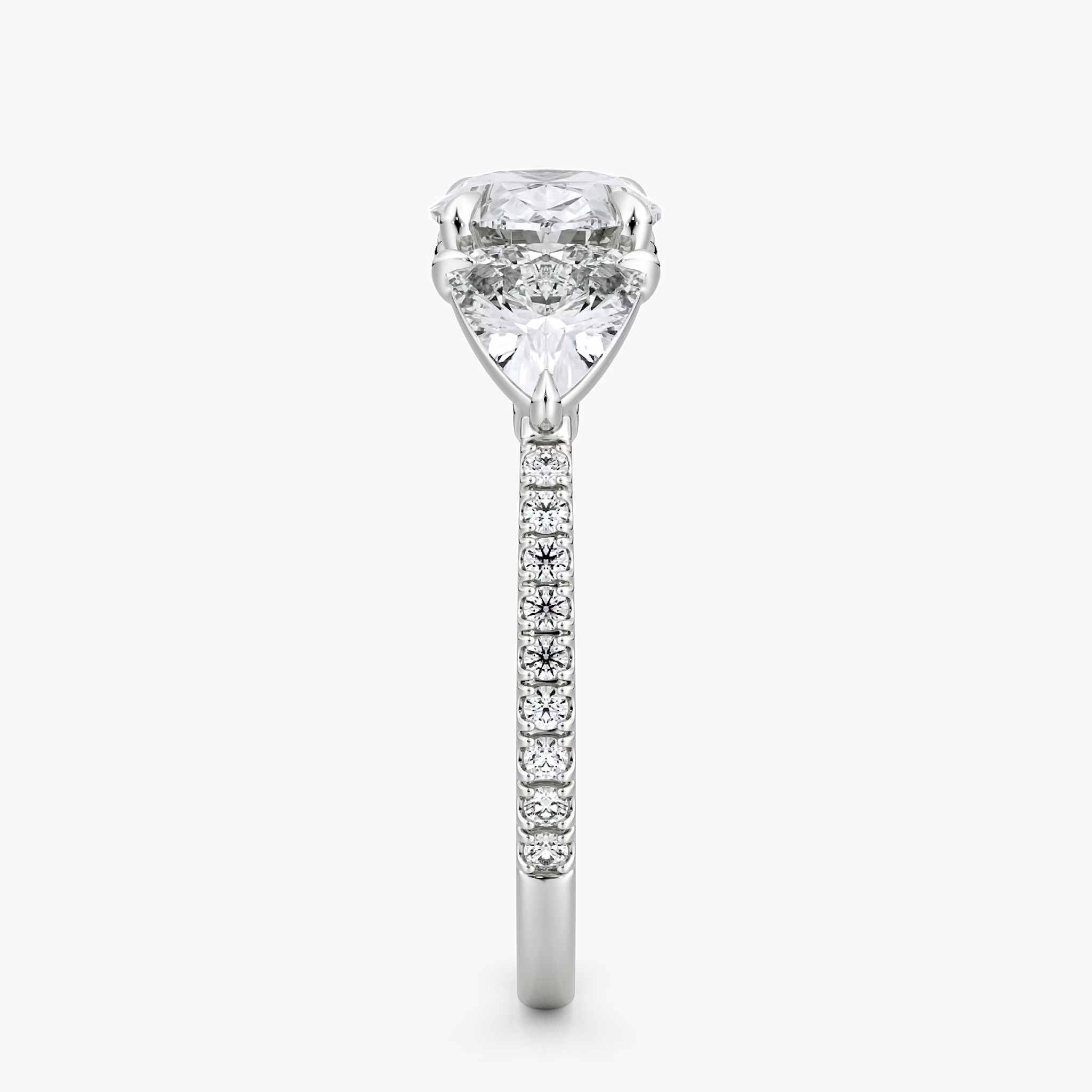 The Three Stone | Oval | 18k | White Gold | bandAccent: Pavé | diamondOrientation: horizontal | sideStoneCarat: 0.50ct | sideStoneShape: Trillion | caratWeight: other