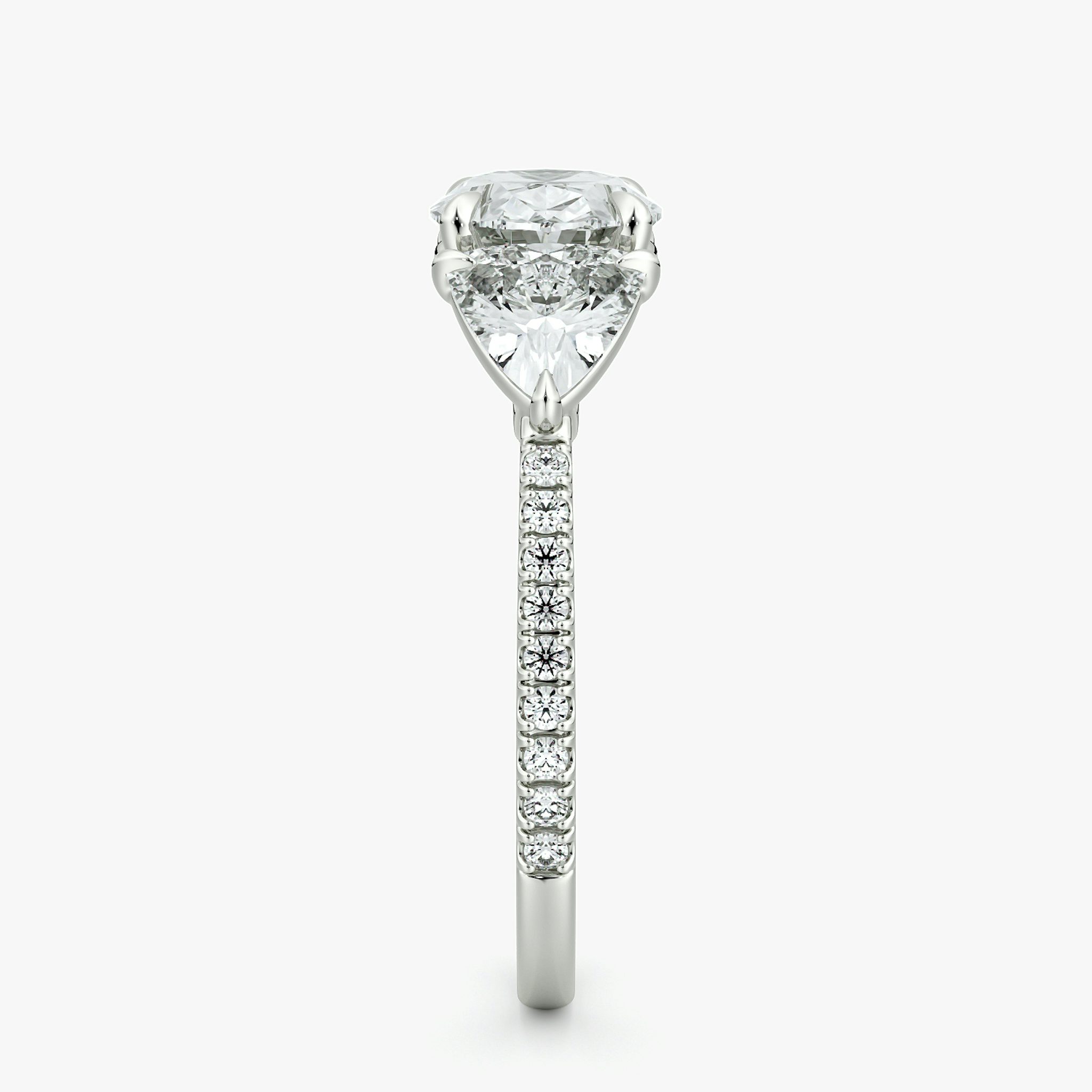 The Three Stone | Oval | 18k | White Gold | bandAccent: Pavé | diamondOrientation: horizontal | sideStoneCarat: 0.50ct | sideStoneShape: Trillion | caratWeight: other