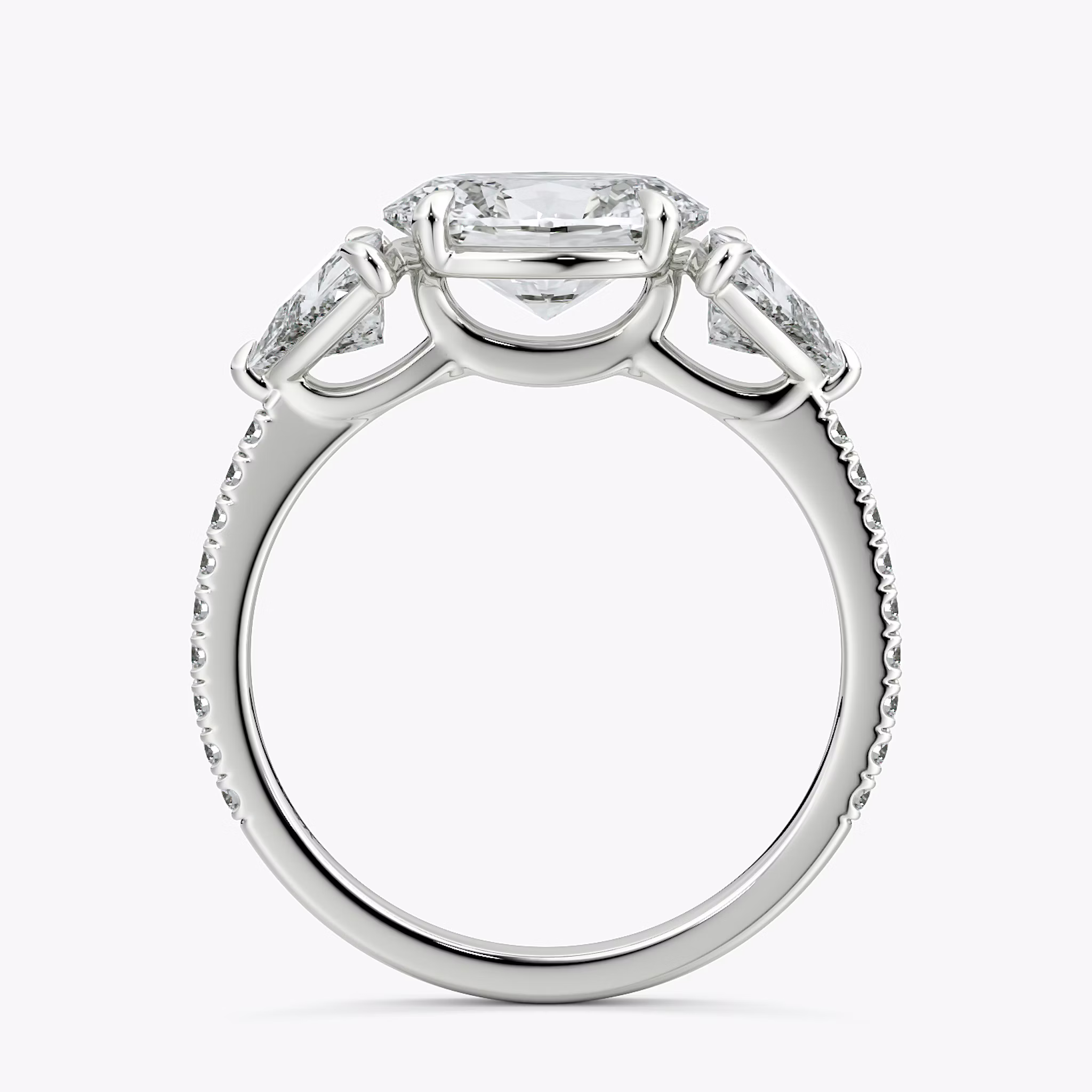 The Three Stone | Oval | 18k | White Gold | bandAccent: Pavé | diamondOrientation: horizontal | sideStoneCarat: 0.50ct | sideStoneShape: Trillion | caratWeight: other