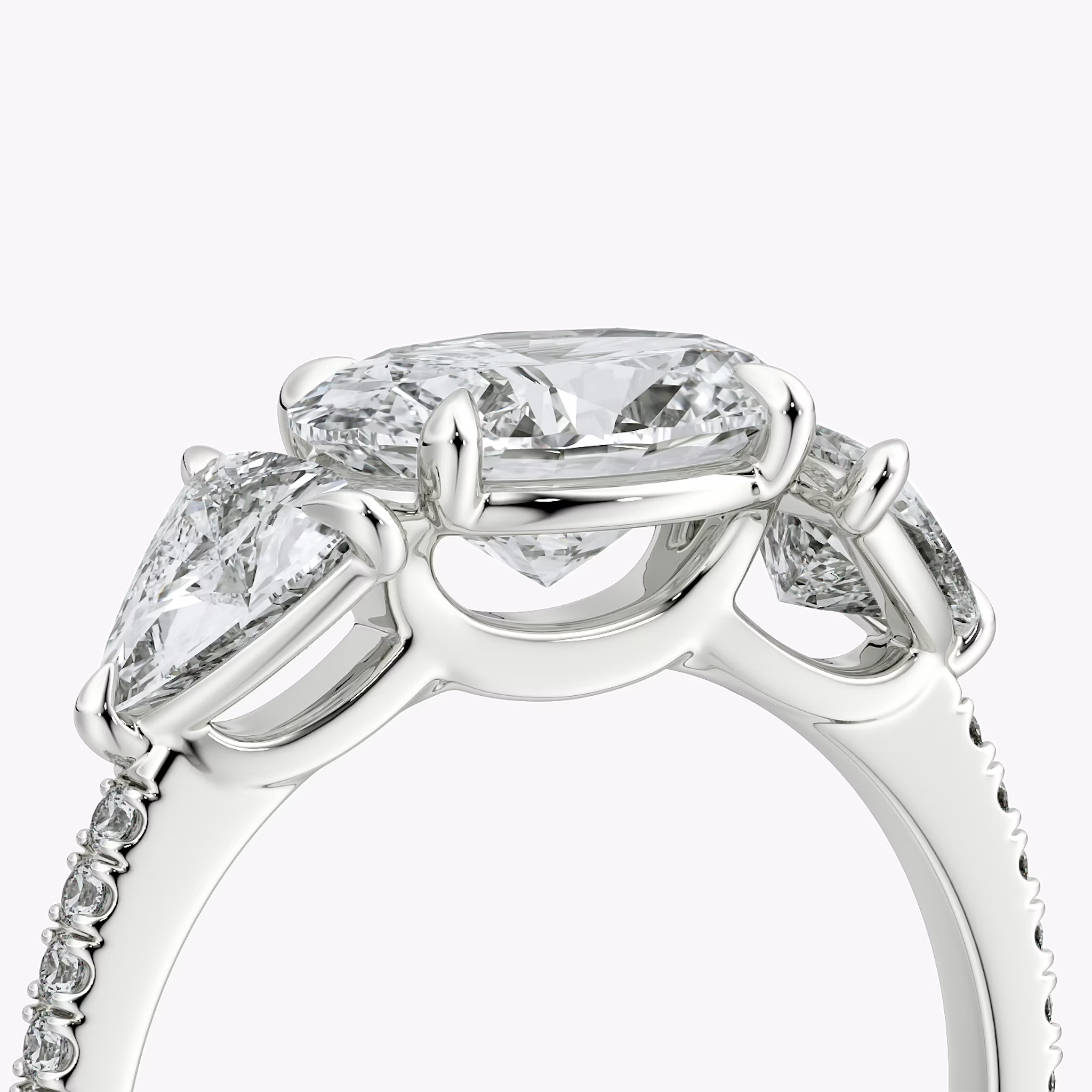The Three Stone | Oval | 18k | White Gold | bandAccent: Pavé | diamondOrientation: horizontal | sideStoneCarat: 0.50ct | sideStoneShape: Trillion | caratWeight: other
