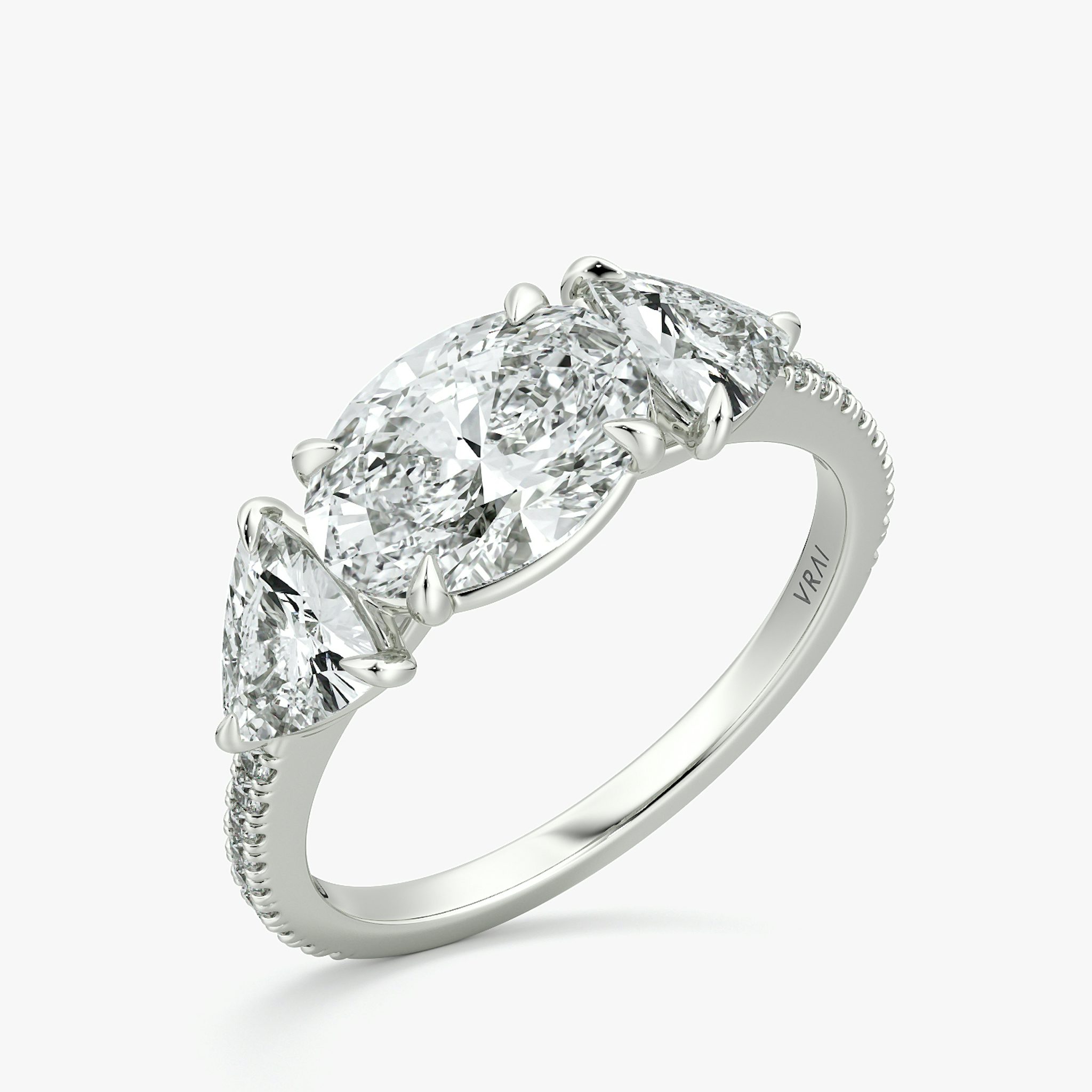 The Three Stone | Oval | 18k | White Gold | bandAccent: Pavé | diamondOrientation: horizontal | sideStoneCarat: 0.50ct | sideStoneShape: Trillion | caratWeight: other