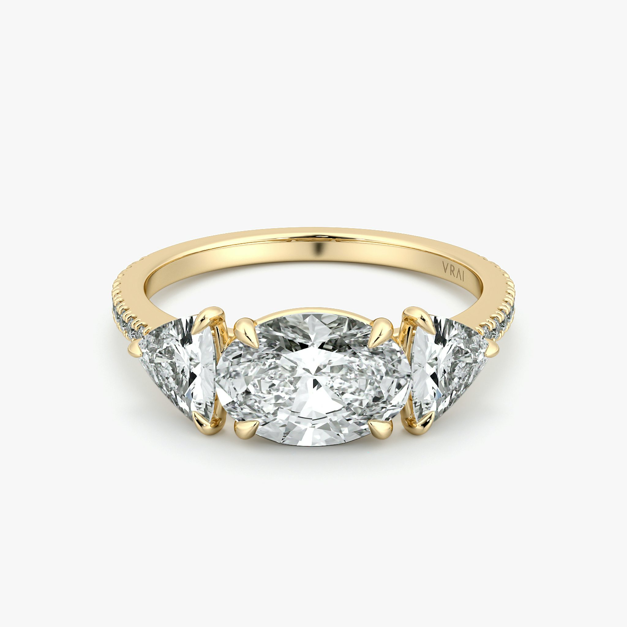 The Three Stone | Oval | 18k | Yellow Gold | bandAccent: Pavé | diamondOrientation: horizontal | sideStoneCarat: 0.50ct | sideStoneShape: Trillion | caratWeight: other