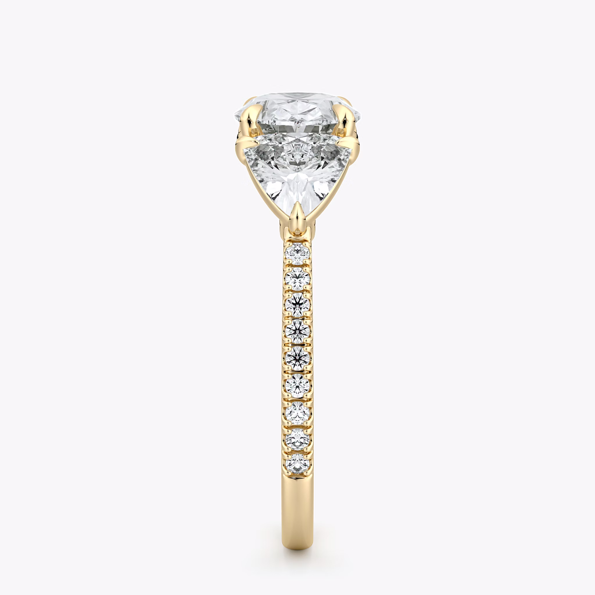The Three Stone | Oval | 18k | Yellow Gold | bandAccent: Pavé | diamondOrientation: horizontal | sideStoneCarat: 0.50ct | sideStoneShape: Trillion | caratWeight: other