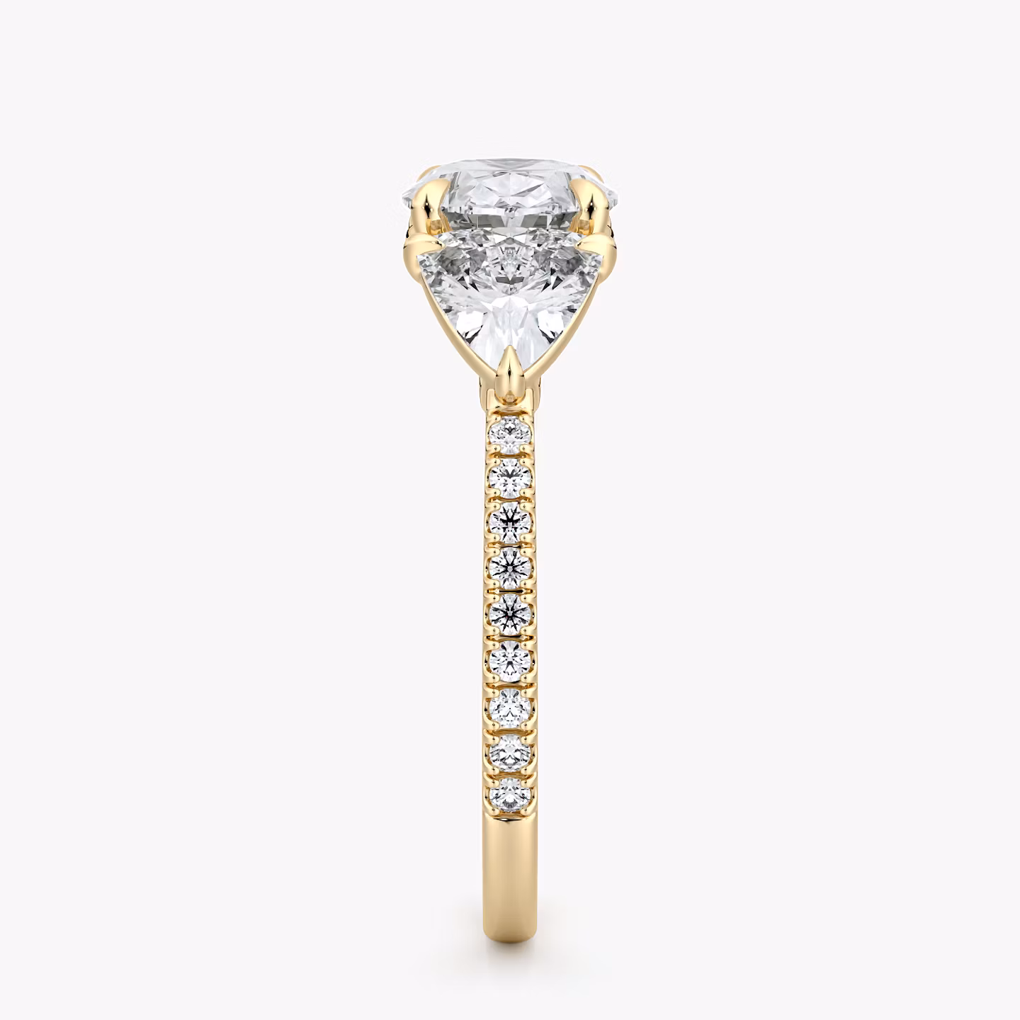 The Three Stone | Oval | 18k | Yellow Gold | bandAccent: Pavé | diamondOrientation: horizontal | sideStoneCarat: 0.50ct | sideStoneShape: Trillion | caratWeight: other
