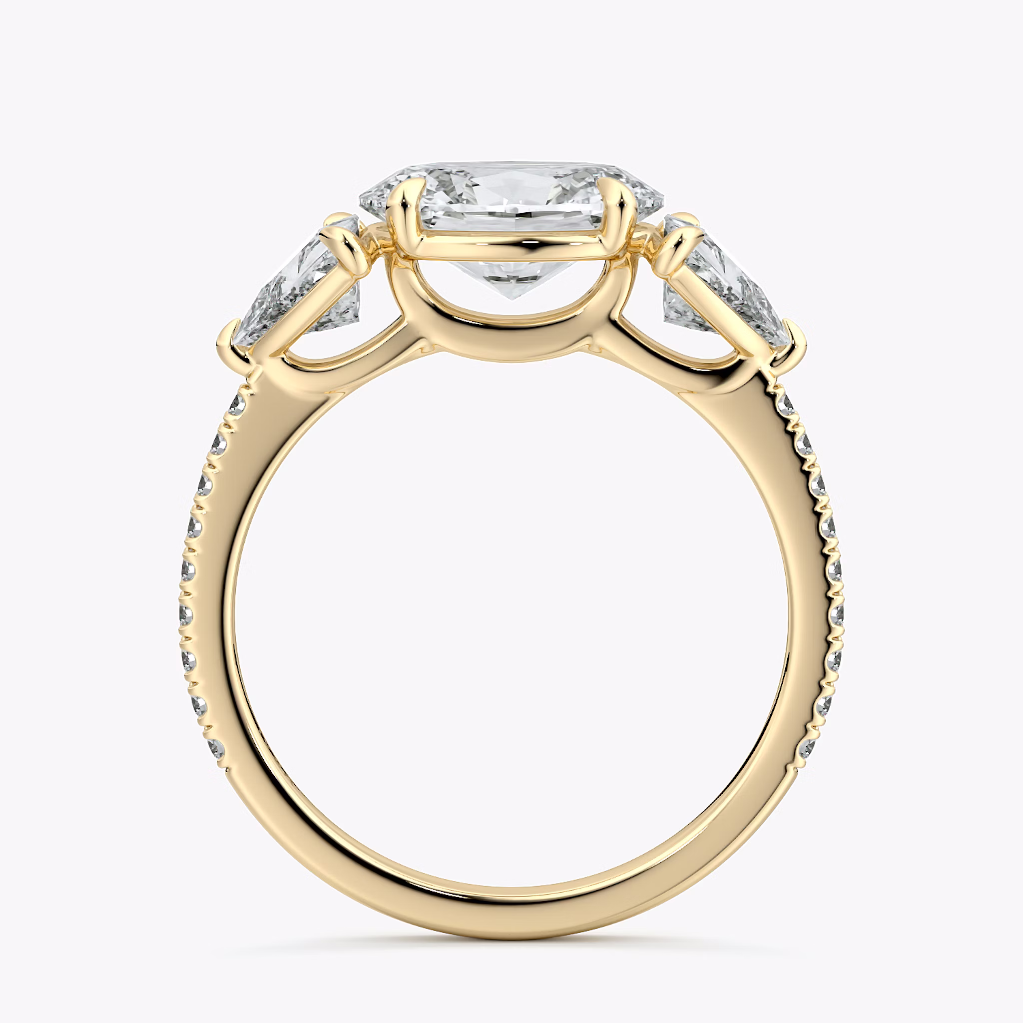 The Three Stone | Oval | 18k | Yellow Gold | bandAccent: Pavé | diamondOrientation: horizontal | sideStoneCarat: 0.50ct | sideStoneShape: Trillion | caratWeight: other