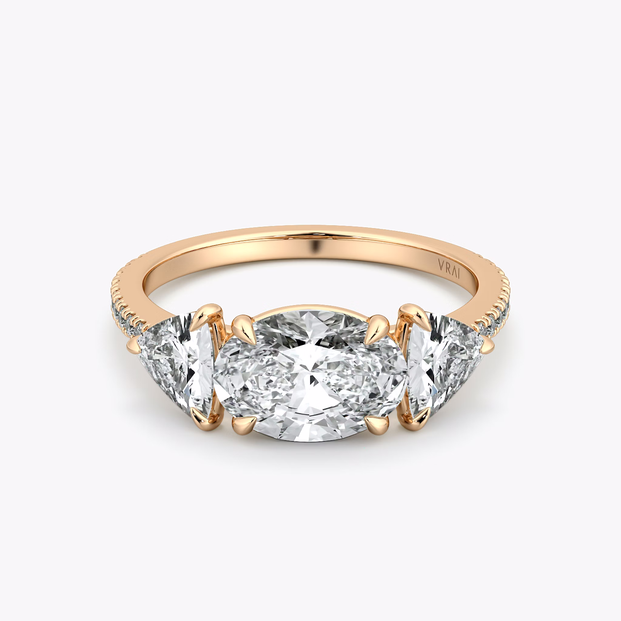 The Three Stone | Oval | 14k | Rose Gold | bandAccent: Pavé | diamondOrientation: horizontal | sideStoneCarat: 0.50ct | sideStoneShape: Trillion | caratWeight: other