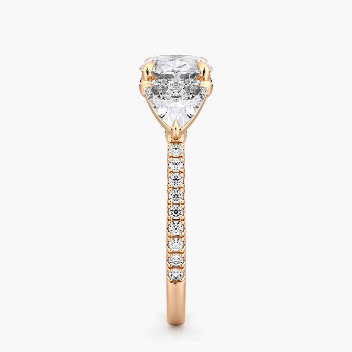 The Three Stone | Oval | 14k | Rose Gold | bandAccent: Pavé | diamondOrientation: horizontal | sideStoneCarat: 0.50ct | sideStoneShape: Trillion | caratWeight: other