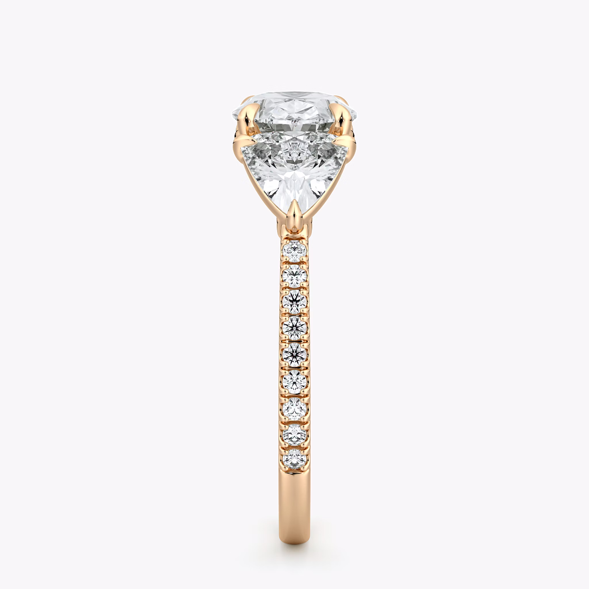 The Three Stone | Oval | 14k | Rose Gold | bandAccent: Pavé | diamondOrientation: horizontal | sideStoneCarat: 0.50ct | sideStoneShape: Trillion | caratWeight: other