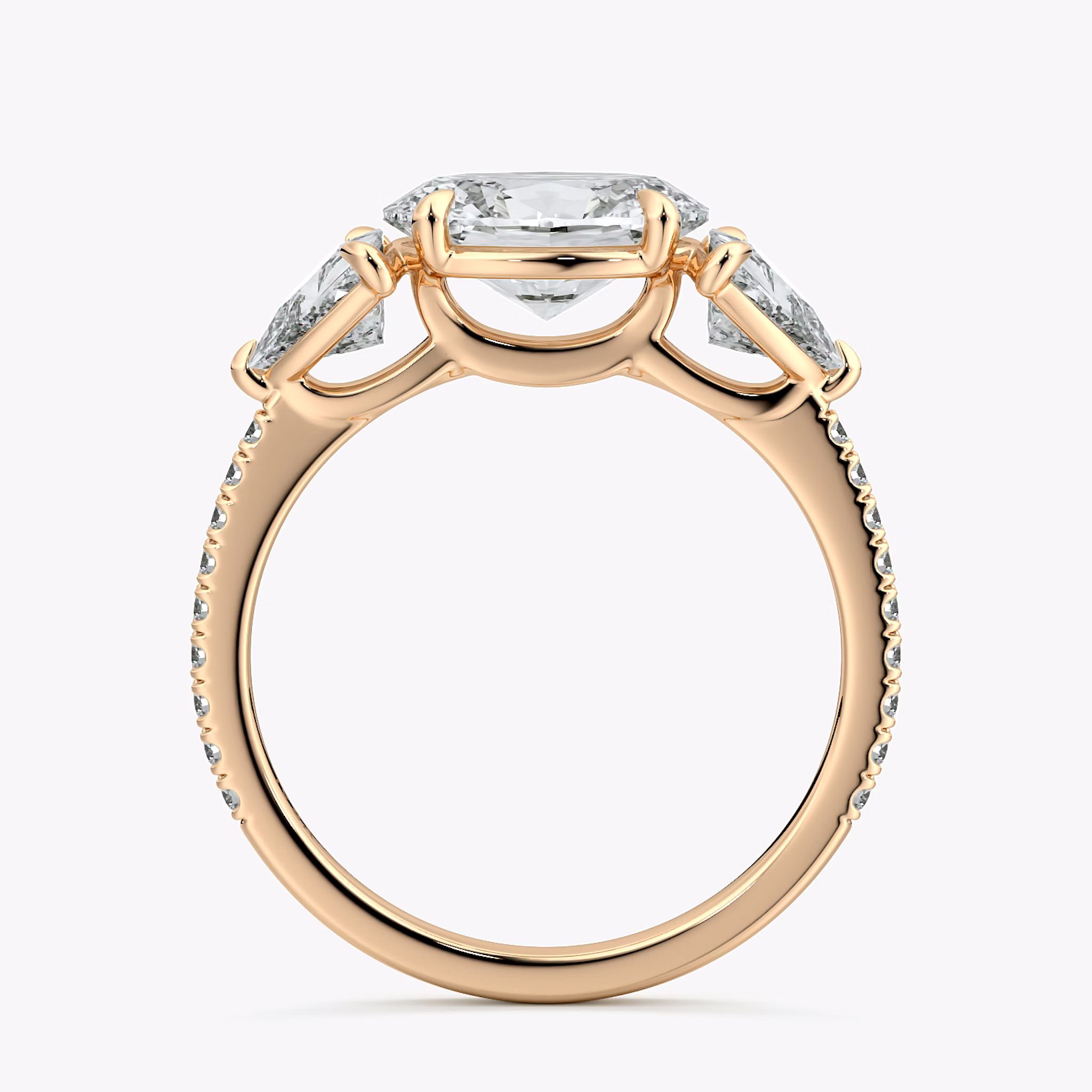 The Three Stone | Oval | 14k | Rose Gold | bandAccent: Pavé | diamondOrientation: horizontal | sideStoneCarat: 0.50ct | sideStoneShape: Trillion | caratWeight: other