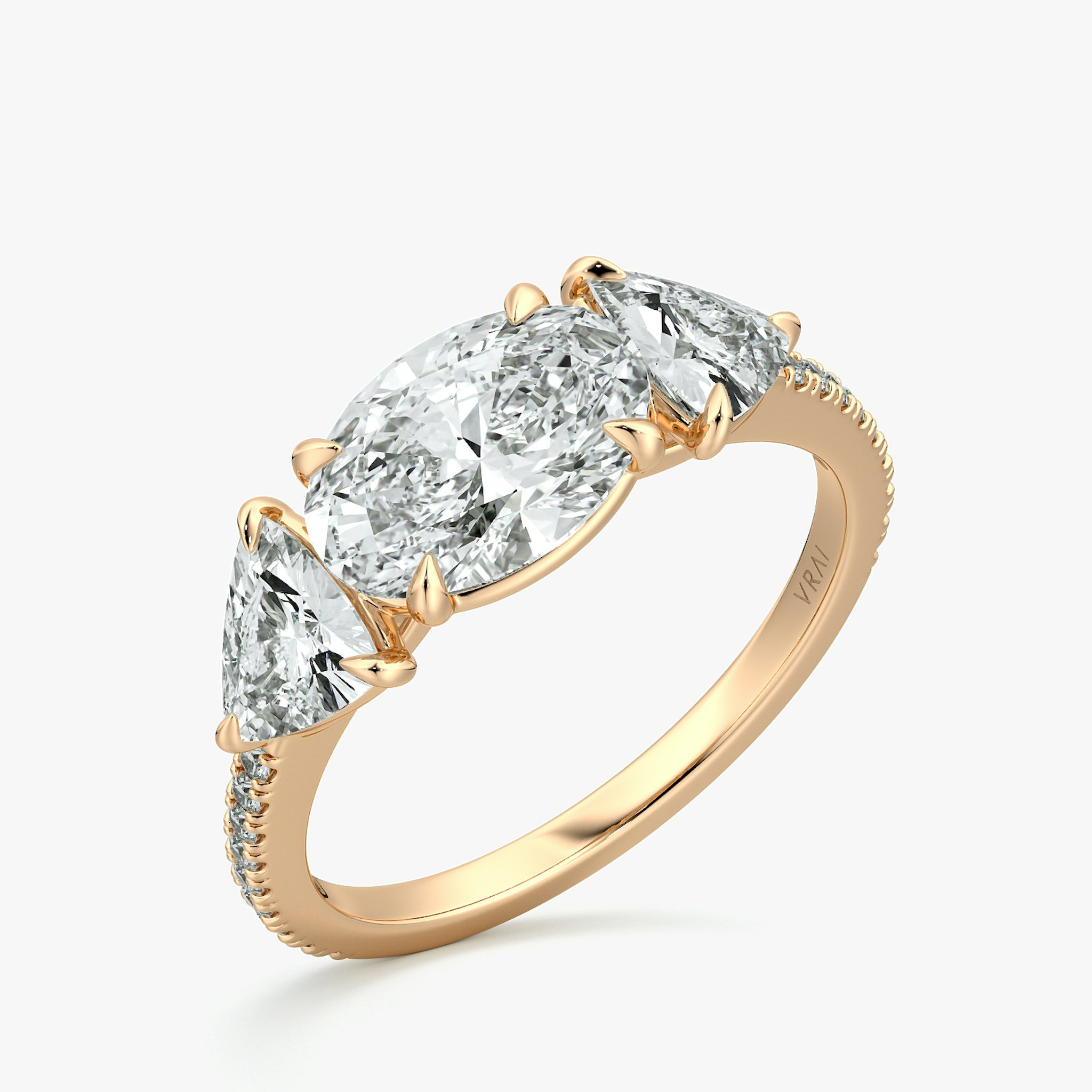 The Three Stone | Oval | 14k | Rose Gold | bandAccent: Pavé | diamondOrientation: horizontal | sideStoneCarat: 0.50ct | sideStoneShape: Trillion | caratWeight: other