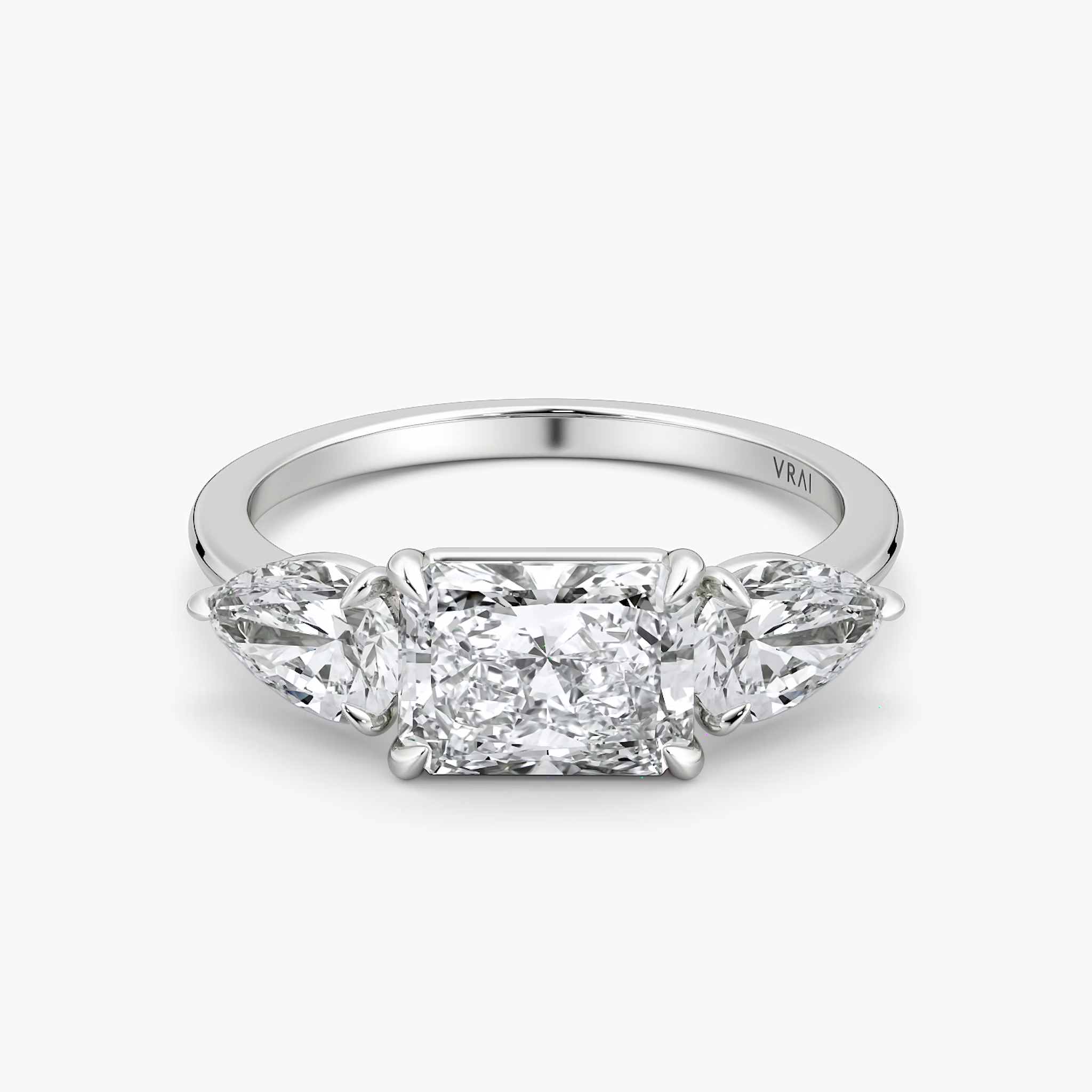 The Three Stone | Radiant | Platinum | bandAccent: Plain | diamondOrientation: horizontal | sideStoneCarat: 0.50ct | sideStoneShape: Pear | caratWeight: other