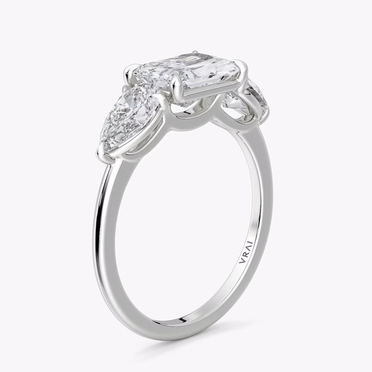 The Three Stone | Radiant | Platinum | bandAccent: Plain | diamondOrientation: horizontal | sideStoneCarat: 0.50ct | sideStoneShape: Pear | caratWeight: other