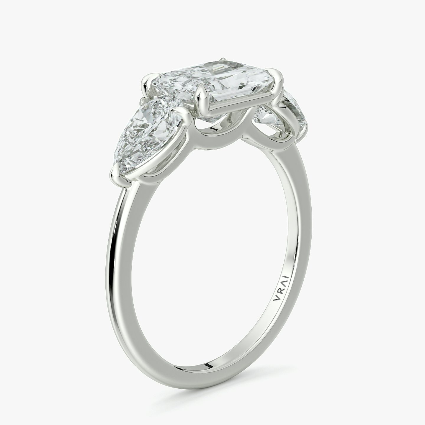 The Three Stone | Radiant | Platinum | bandAccent: Plain | diamondOrientation: horizontal | sideStoneCarat: 0.50ct | sideStoneShape: Pear | caratWeight: other