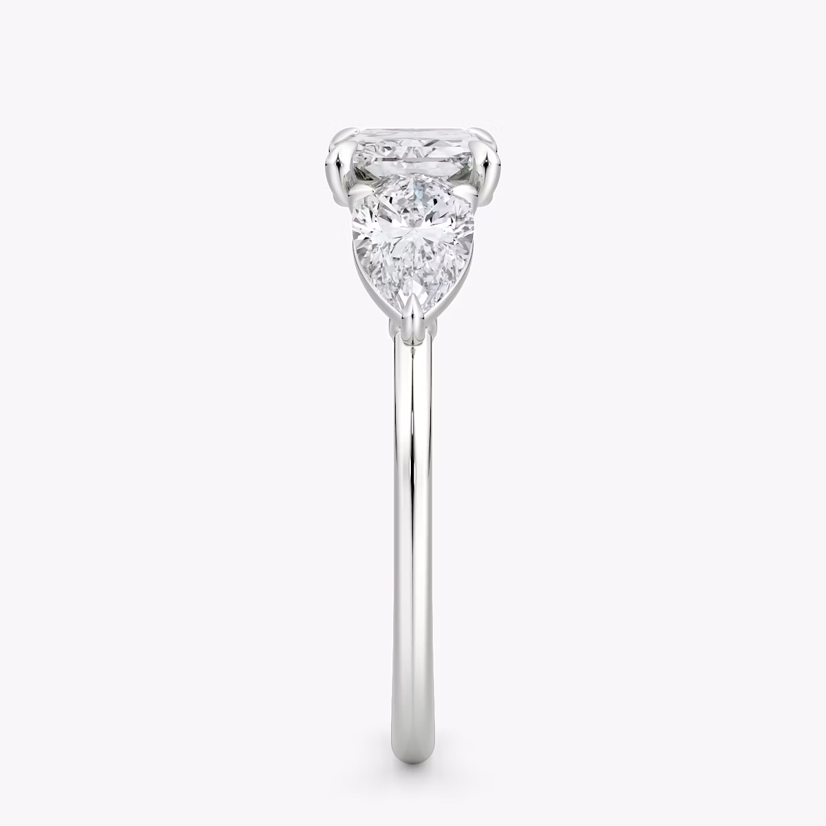 The Three Stone | Radiant | Platinum | bandAccent: Plain | diamondOrientation: horizontal | sideStoneCarat: 0.50ct | sideStoneShape: Pear | caratWeight: other