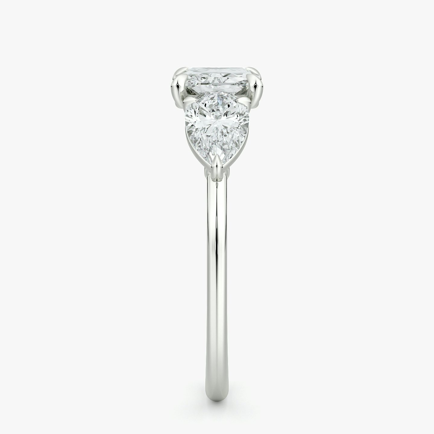 The Three Stone | Radiant | Platinum | bandAccent: Plain | diamondOrientation: horizontal | sideStoneCarat: 0.50ct | sideStoneShape: Pear | caratWeight: other