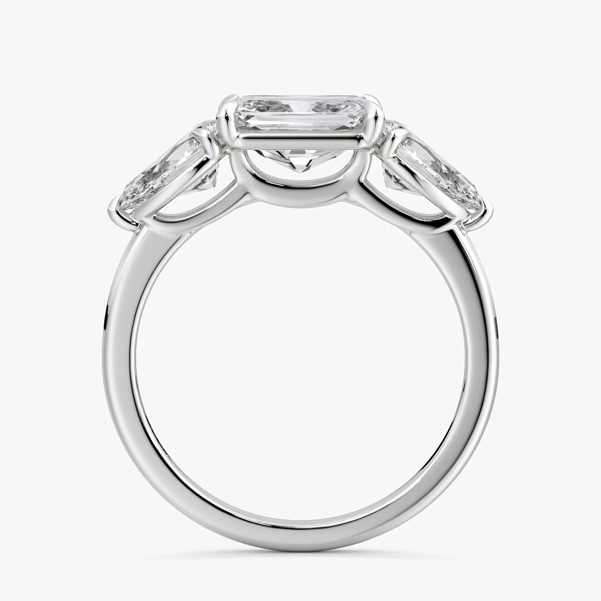 The Three Stone | Radiant | Platinum | bandAccent: Plain | diamondOrientation: horizontal | sideStoneCarat: 0.50ct | sideStoneShape: Pear | caratWeight: other