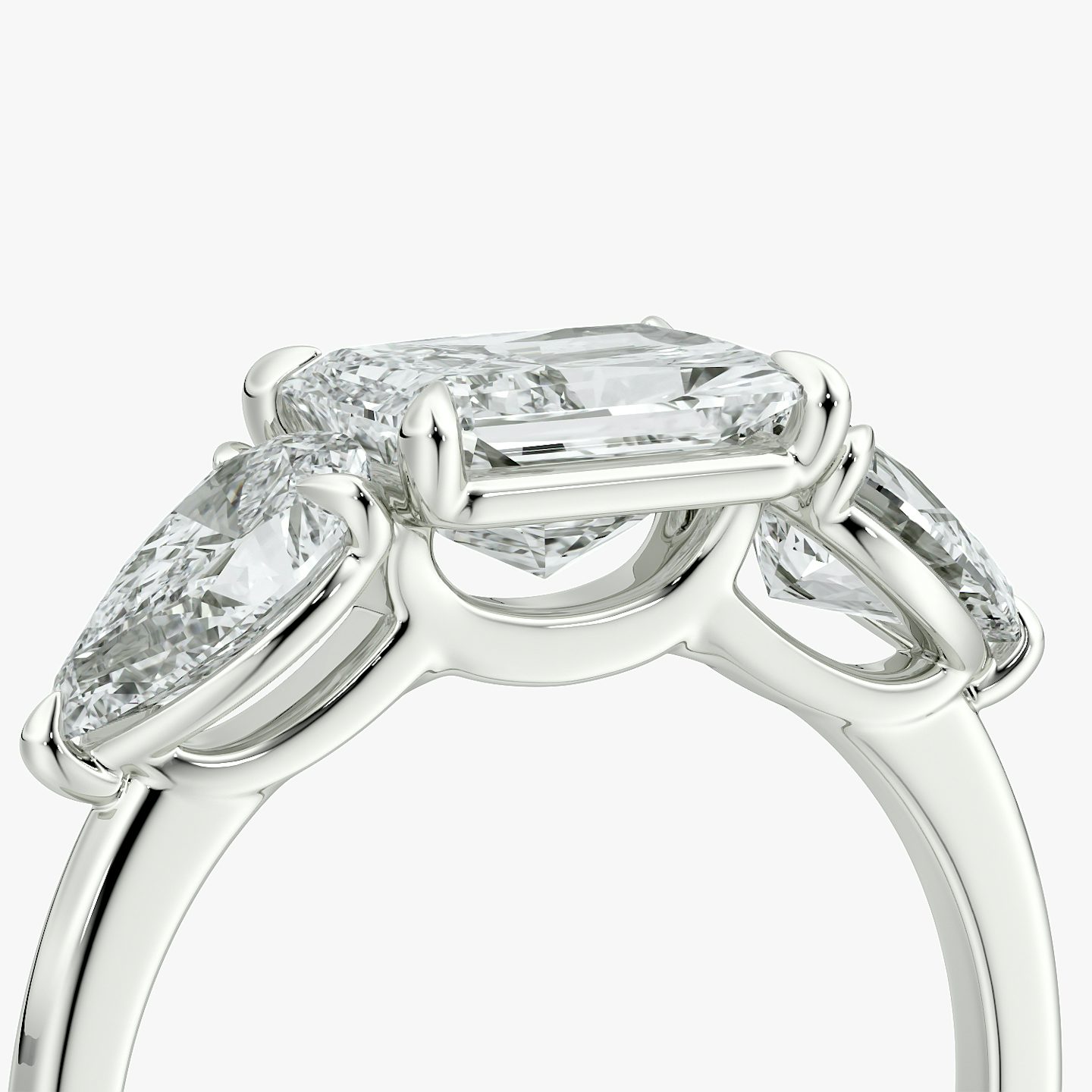 The Three Stone | Radiant | Platinum | bandAccent: Plain | diamondOrientation: horizontal | sideStoneCarat: 0.50ct | sideStoneShape: Pear | caratWeight: other
