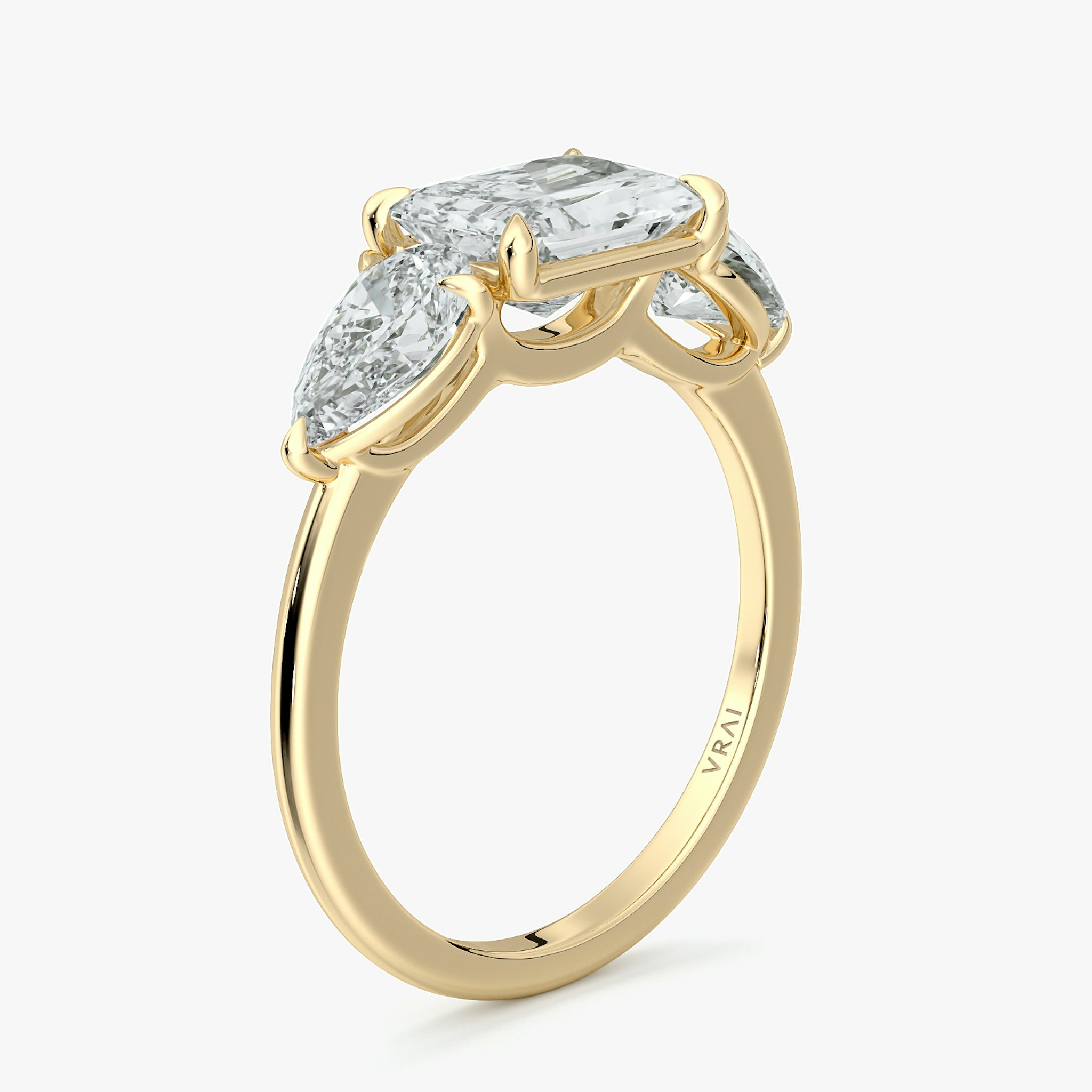 The Three Stone | Radiant | 18k | Yellow Gold | bandAccent: Plain | diamondOrientation: horizontal | sideStoneCarat: 0.50ct | sideStoneShape: Pear | caratWeight: other