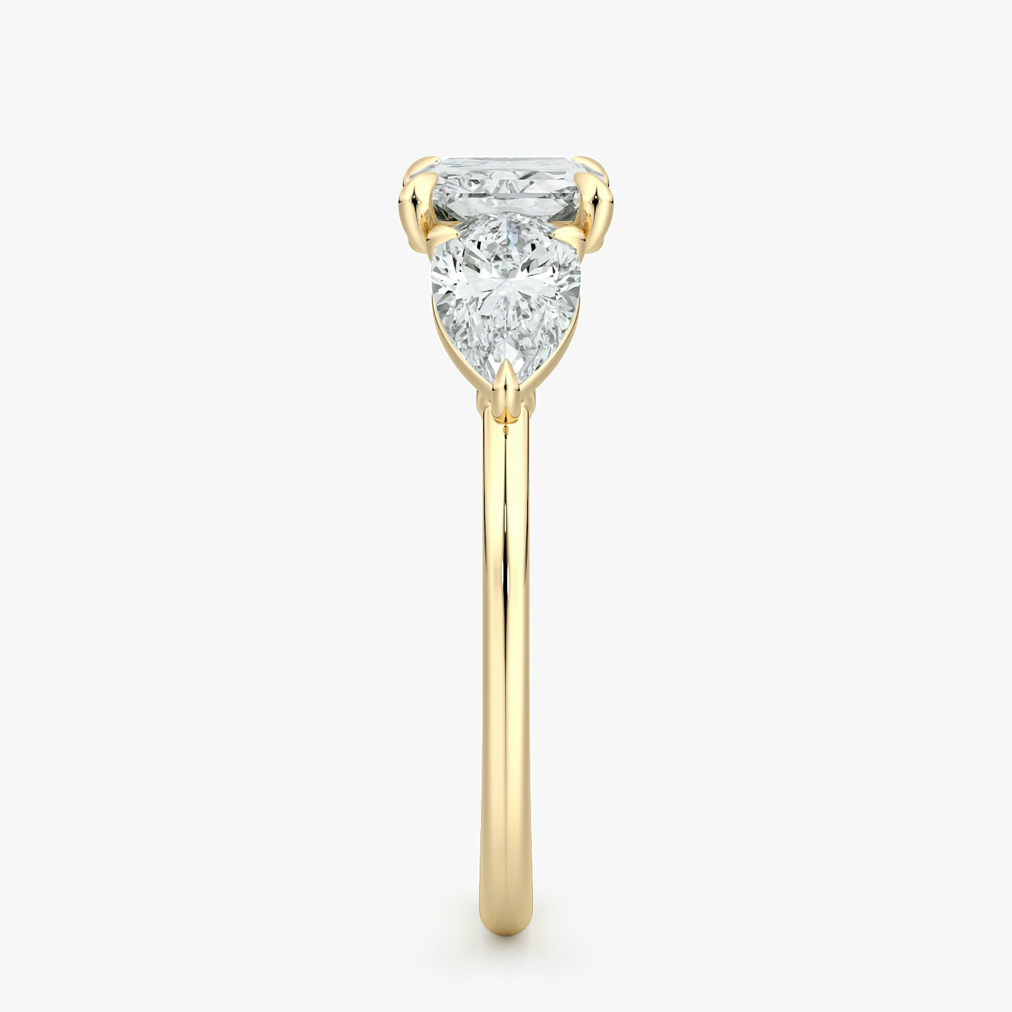 The Three Stone | Radiant | 18k | Yellow Gold | bandAccent: Plain | diamondOrientation: horizontal | sideStoneCarat: 0.50ct | sideStoneShape: Pear | caratWeight: other
