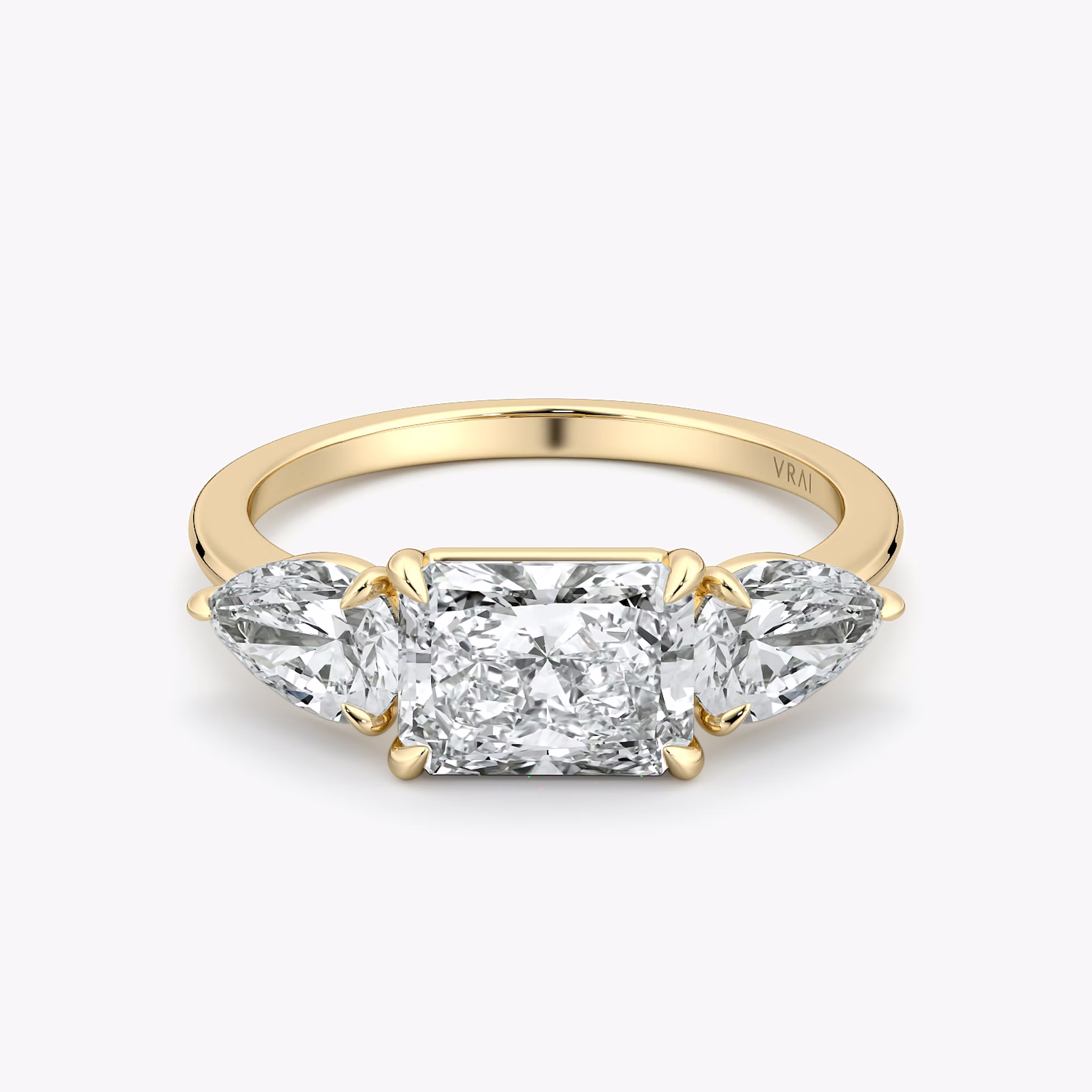 The Three Stone | Radiant | 18k | Yellow Gold | bandAccent: Plain | diamondOrientation: horizontal | sideStoneCarat: 0.50ct | sideStoneShape: Pear | caratWeight: other