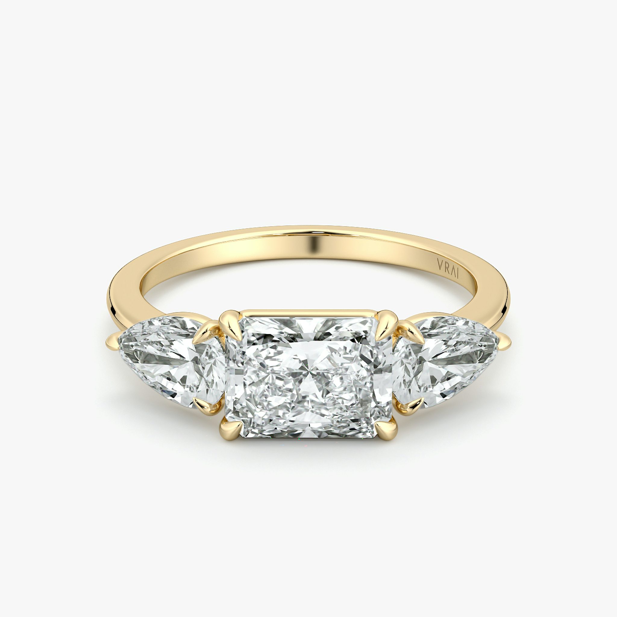 The Three Stone | Radiant | 18k | Yellow Gold | bandAccent: Plain | diamondOrientation: horizontal | sideStoneCarat: 0.50ct | sideStoneShape: Pear | caratWeight: other