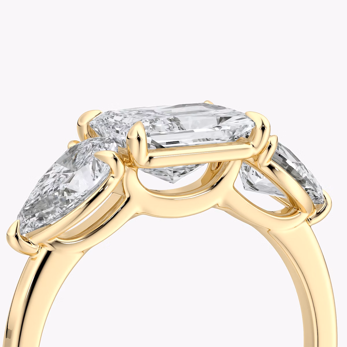 The Three Stone | Radiant | 18k | Yellow Gold | bandAccent: Plain | diamondOrientation: horizontal | sideStoneCarat: 0.50ct | sideStoneShape: Pear | caratWeight: other