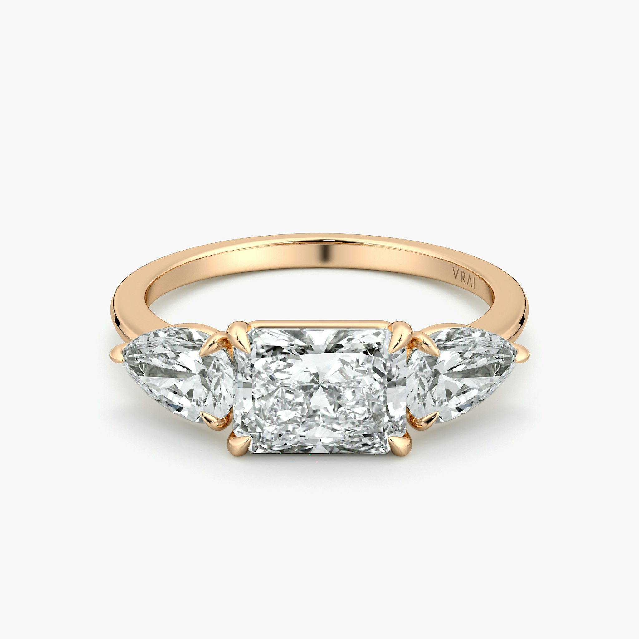 The Three Stone | Radiant | 14k | Rose Gold | bandAccent: Plain | diamondOrientation: horizontal | sideStoneCarat: 0.50ct | sideStoneShape: Pear | caratWeight: other