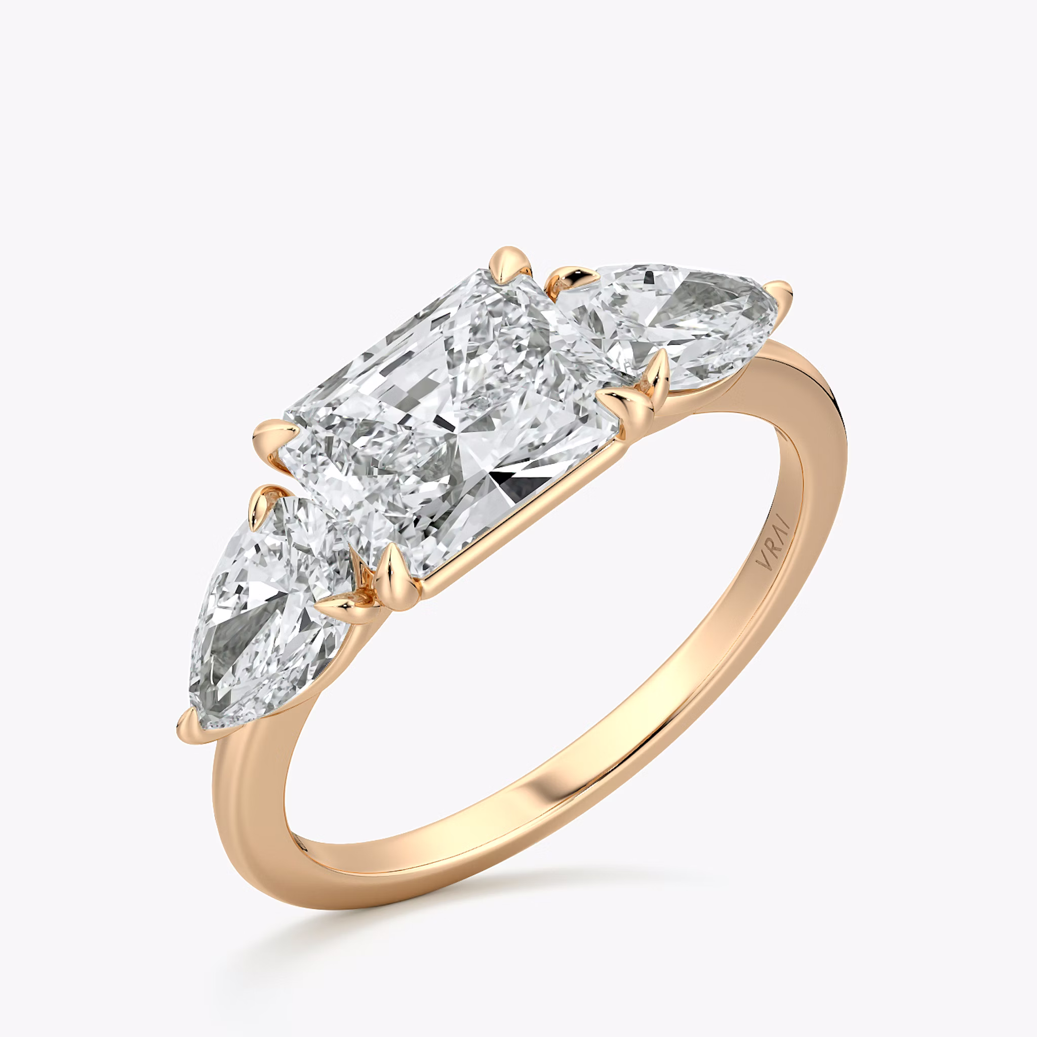 The Three Stone | Radiant | 14k | Rose Gold | bandAccent: Plain | diamondOrientation: horizontal | sideStoneCarat: 0.50ct | sideStoneShape: Pear | caratWeight: other