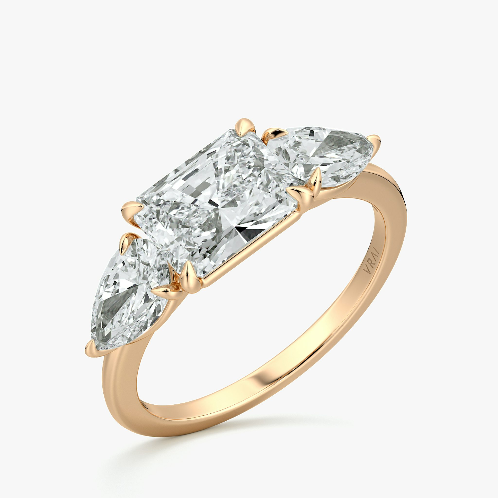 The Three Stone | Radiant | 14k | Rose Gold | bandAccent: Plain | diamondOrientation: horizontal | sideStoneCarat: 0.50ct | sideStoneShape: Pear | caratWeight: other