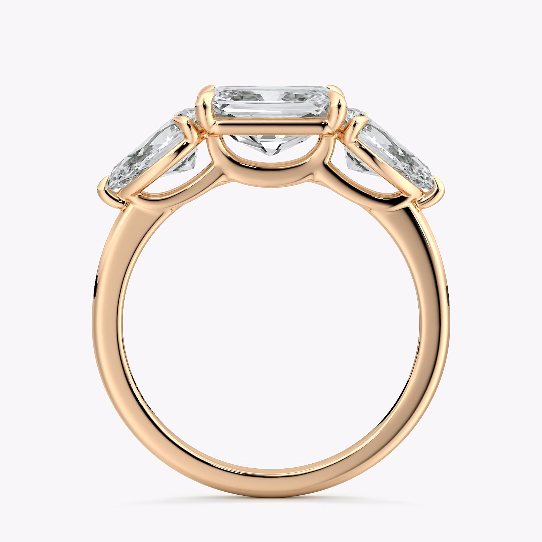 The Three Stone | Radiant | 14k | Rose Gold | bandAccent: Plain | diamondOrientation: horizontal | sideStoneCarat: 0.50ct | sideStoneShape: Pear | caratWeight: other