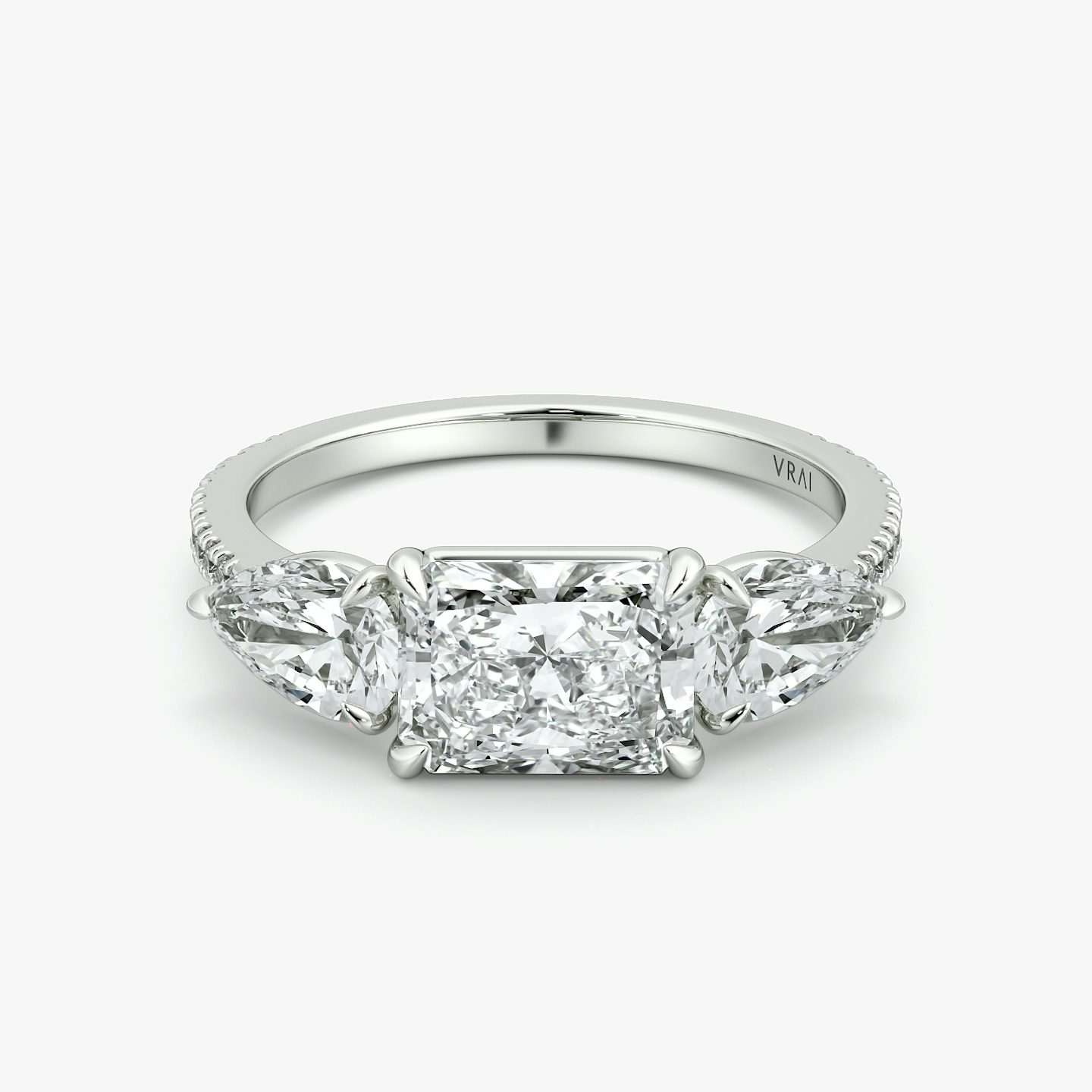 The Three Stone | Radiant | Platinum | bandAccent: Pavé | diamondOrientation: horizontal | sideStoneCarat: 0.50ct | sideStoneShape: Pear | caratWeight: other