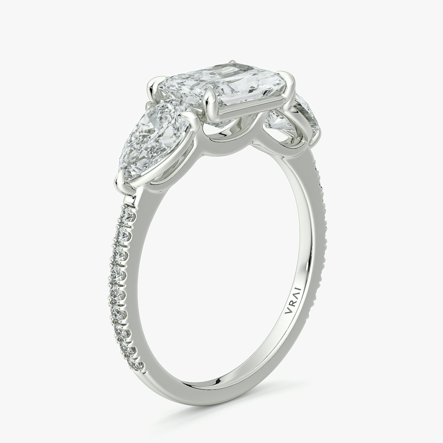 The Three Stone | Radiant | Platinum | bandAccent: Pavé | diamondOrientation: horizontal | sideStoneCarat: 0.50ct | sideStoneShape: Pear | caratWeight: other