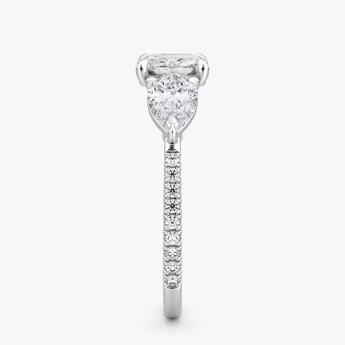The Three Stone | Radiant | 18k | White Gold | bandAccent: Pavé | diamondOrientation: horizontal | sideStoneCarat: 0.50ct | sideStoneShape: Pear | caratWeight: other