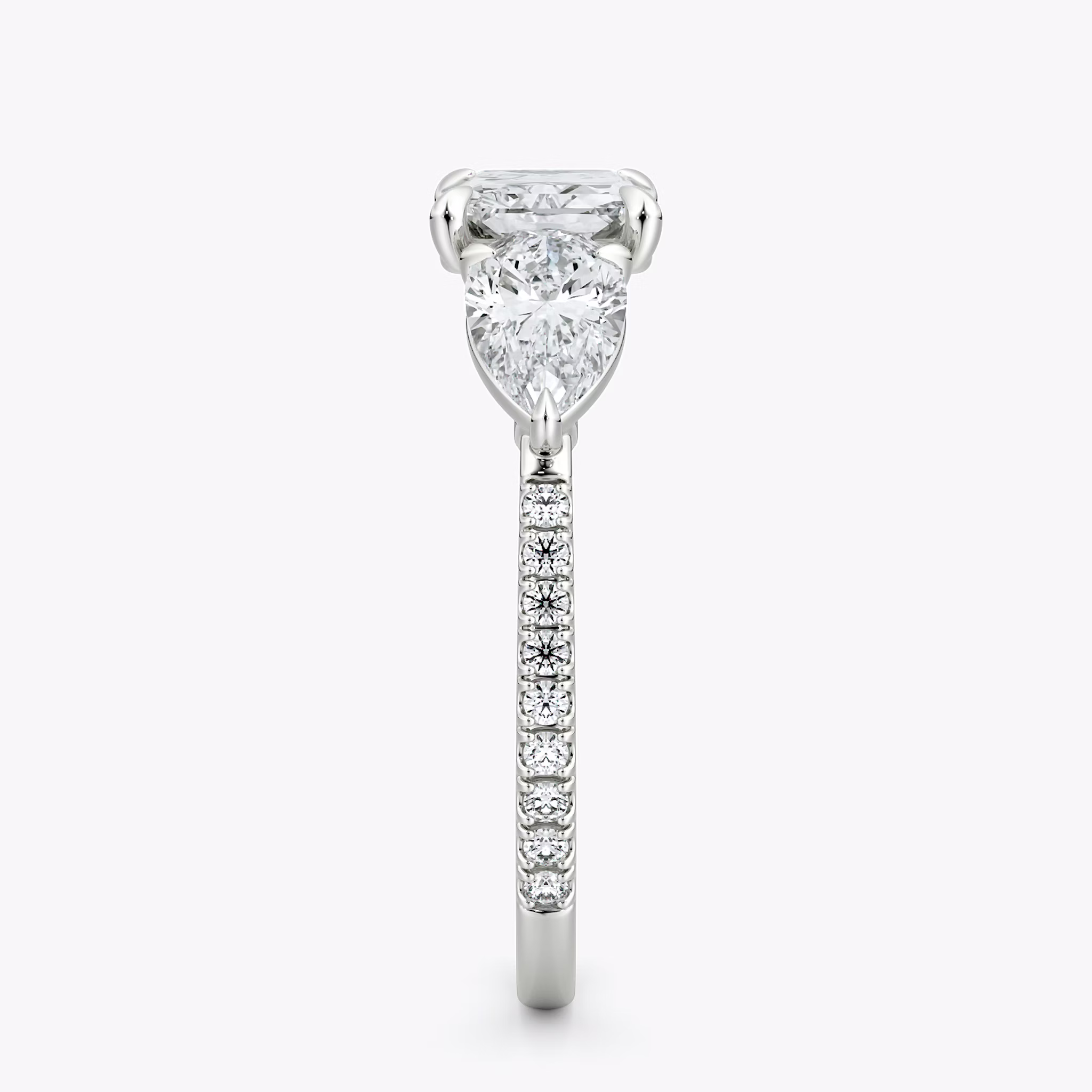 The Three Stone | Radiant | Platinum | bandAccent: Pavé | diamondOrientation: horizontal | sideStoneCarat: 0.50ct | sideStoneShape: Pear | caratWeight: other