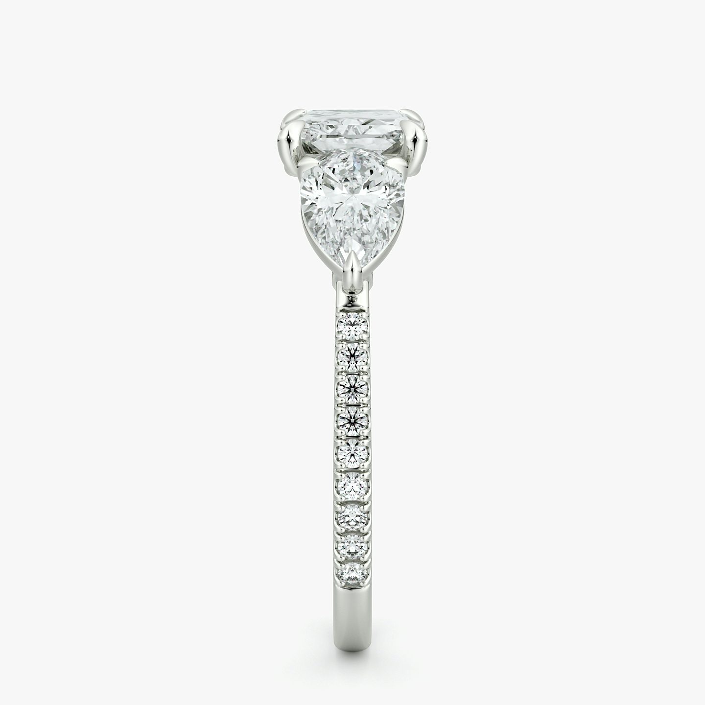 The Three Stone | Radiant | Platinum | bandAccent: Pavé | diamondOrientation: horizontal | sideStoneCarat: 0.50ct | sideStoneShape: Pear | caratWeight: other