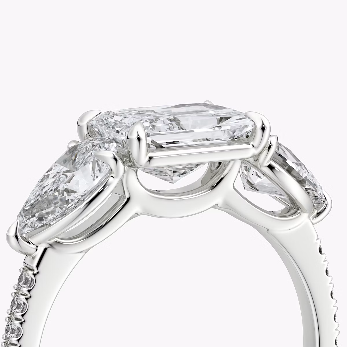 The Three Stone | Radiant | 18k | White Gold | bandAccent: Pavé | diamondOrientation: horizontal | sideStoneCarat: 0.50ct | sideStoneShape: Pear | caratWeight: other